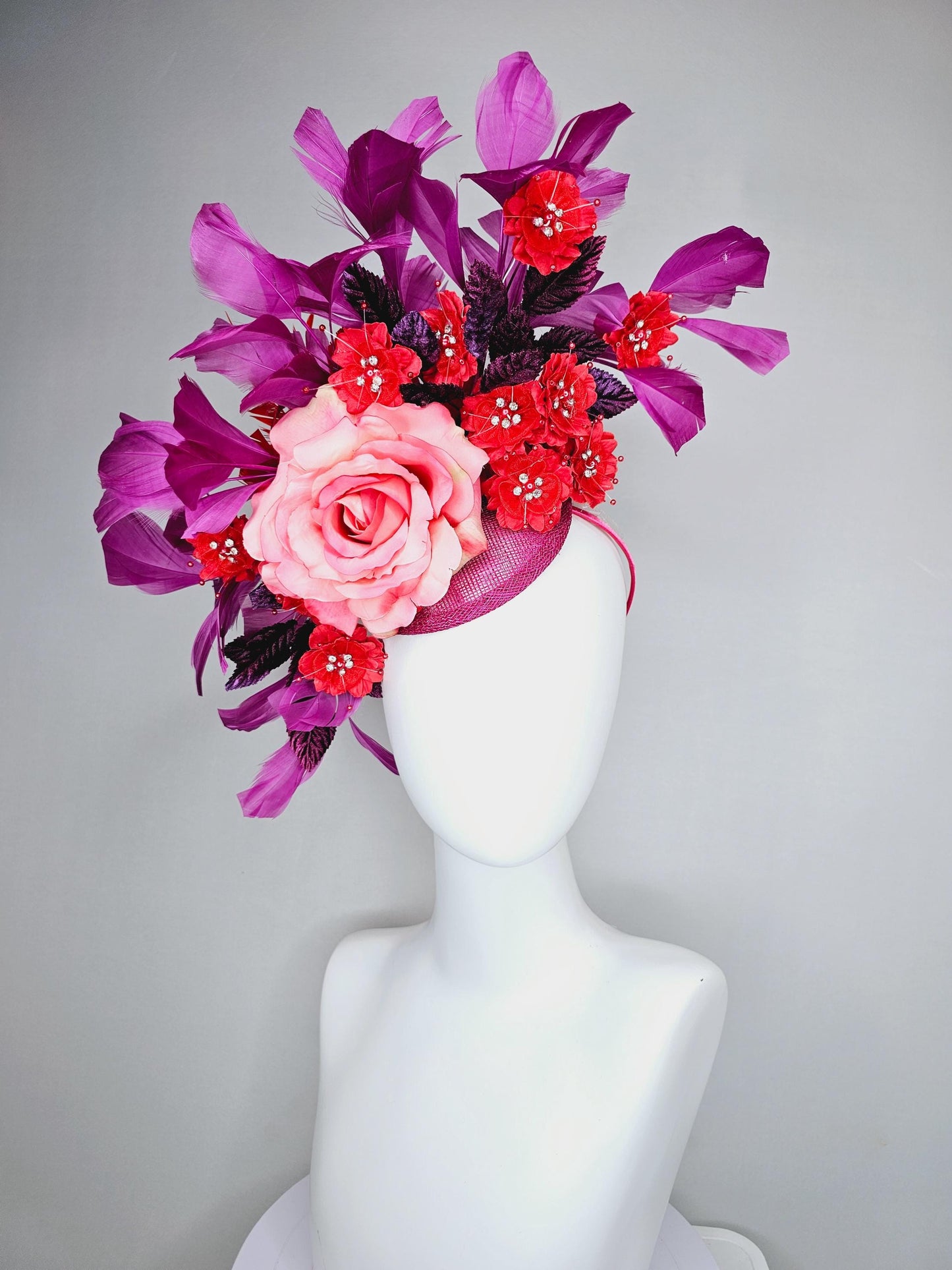 kentucky derby hat fascinator pink ombre satin rose, scarlet red satin flowers, purple leaves, magenta purple branching feathers