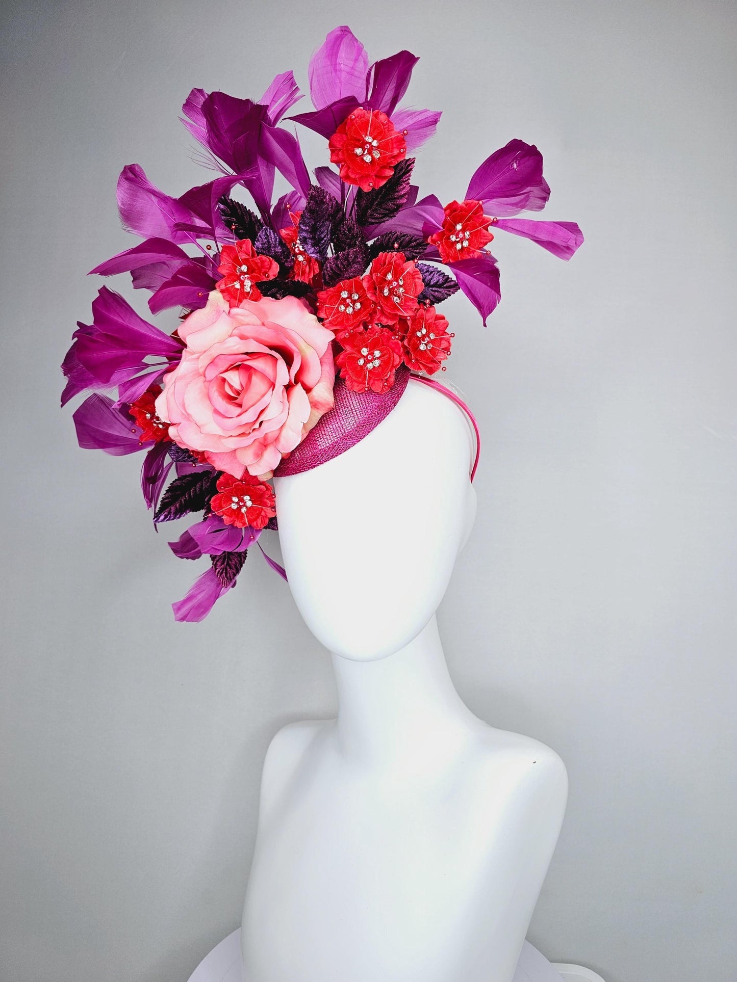 kentucky derby hat fascinator pink ombre satin rose, scarlet red satin flowers, purple leaves, magenta purple branching feathers