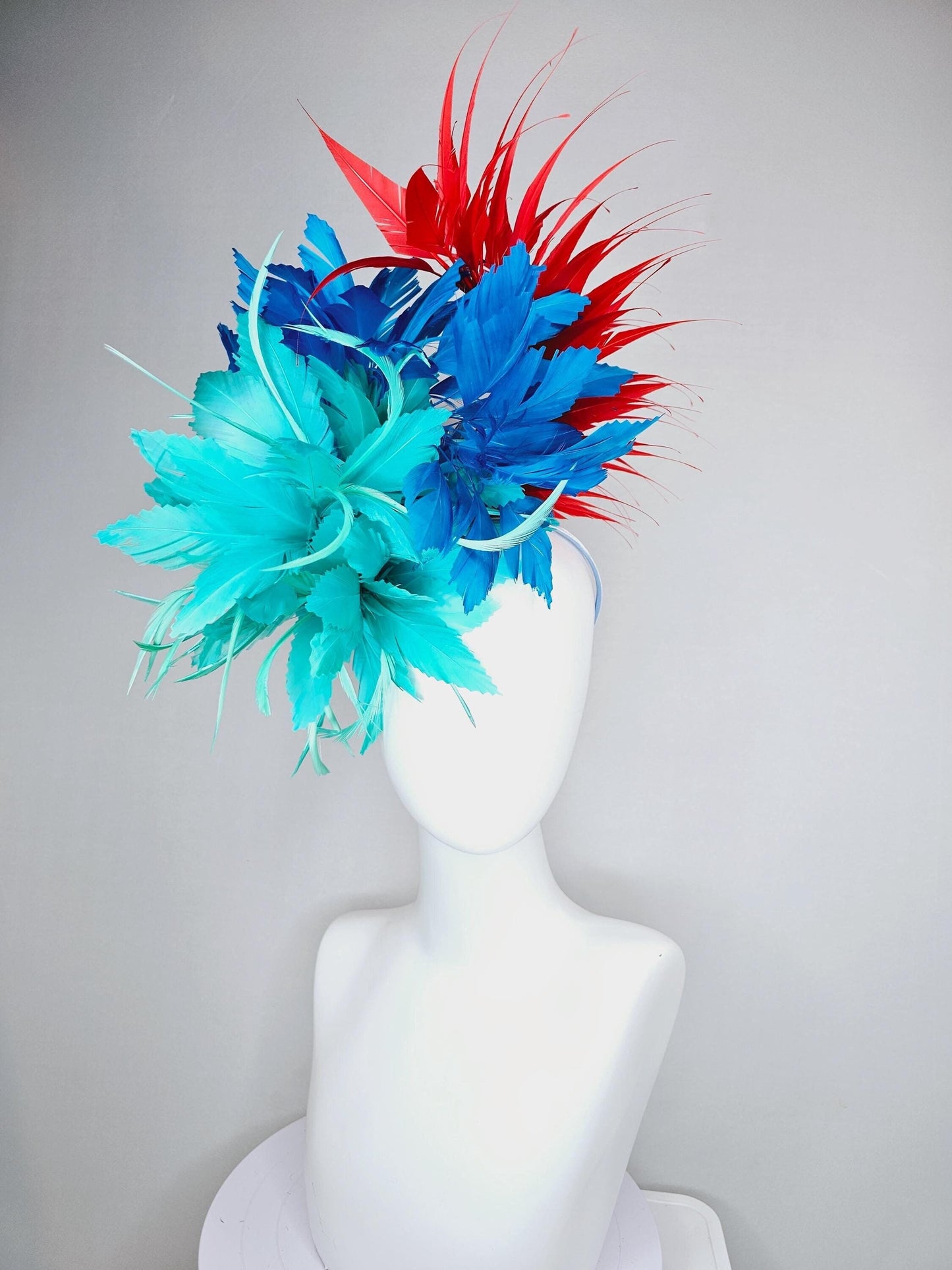 kentucky derby hat fascinator with fluffy aqua blue mint green cobalt blue zigzag feather flowers and red branching feathers