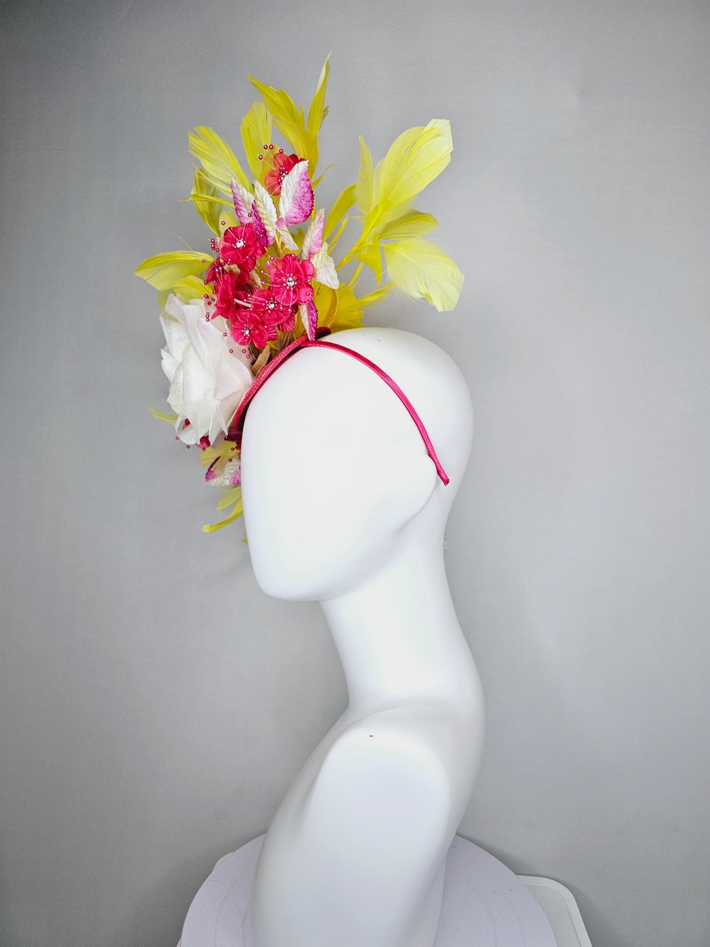 kentucky derby hat fascinator ivory white satin rose,hot pink satin flowers with pearls, yellow pink ombre leaves, yellow branching feathers