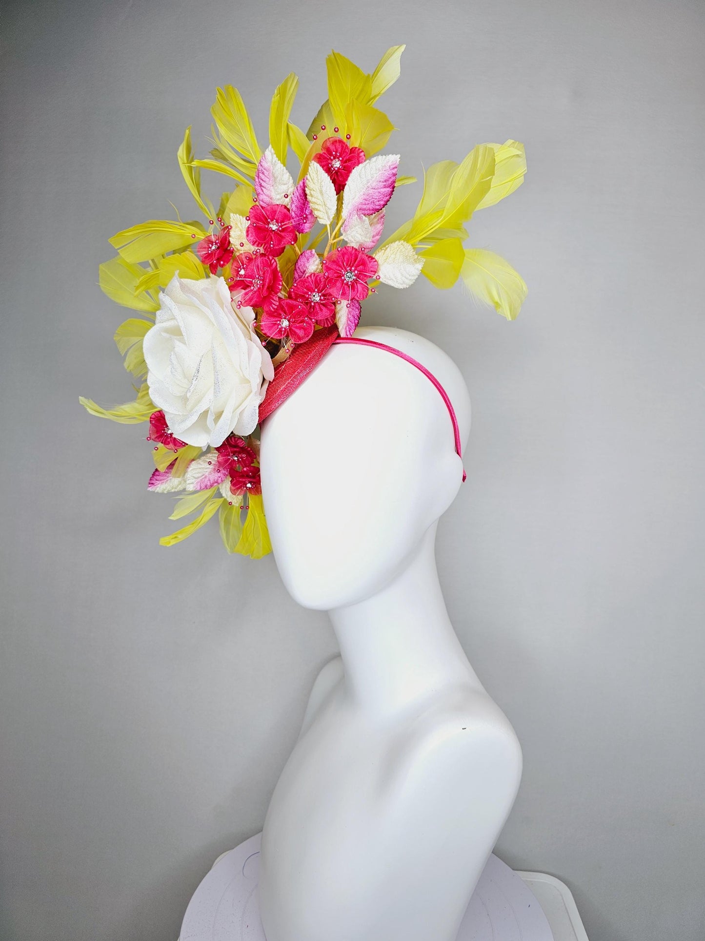 kentucky derby hat fascinator ivory white satin rose,hot pink satin flowers with pearls, yellow pink ombre leaves, yellow branching feathers