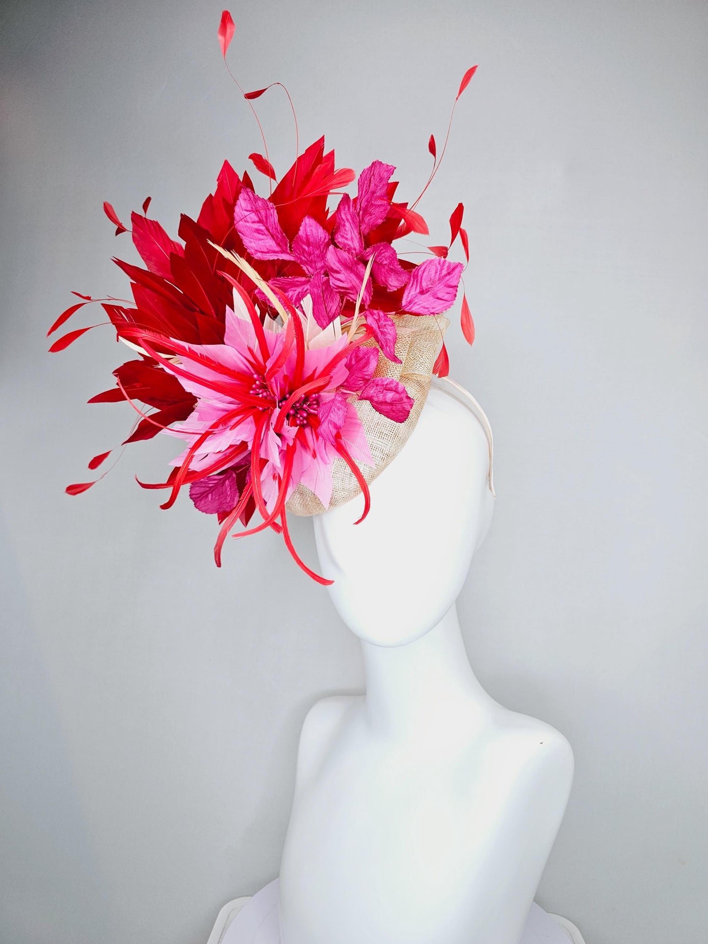 kentucky derby hat fascinator neutral beige sinamay with blush pink beige feather flower, bright pink leaves, scarlet red branching feathers