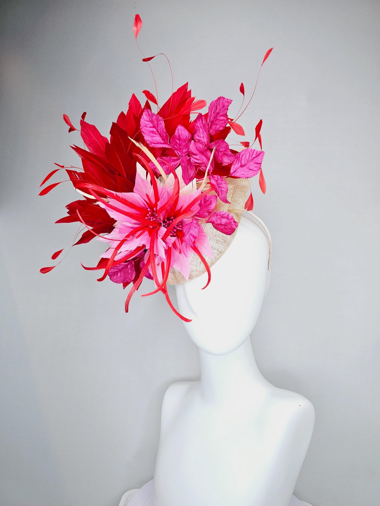 kentucky derby hat fascinator neutral beige sinamay with blush pink beige feather flower, bright pink leaves, scarlet red branching feathers