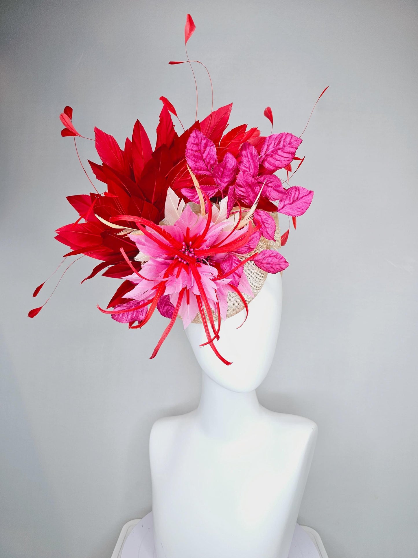 kentucky derby hat fascinator neutral beige sinamay with blush pink beige feather flower, bright pink leaves, scarlet red branching feathers