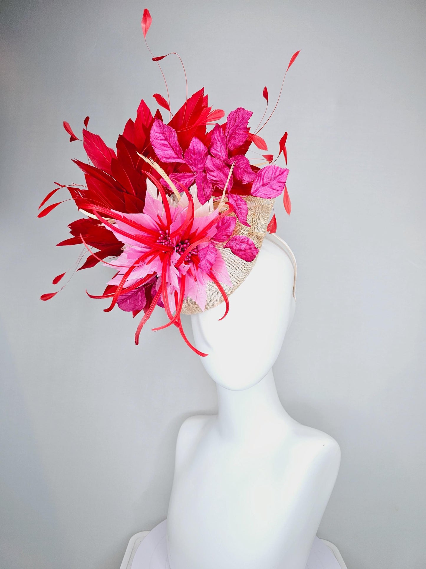 kentucky derby hat fascinator neutral beige sinamay with blush pink beige feather flower, bright pink leaves, scarlet red branching feathers