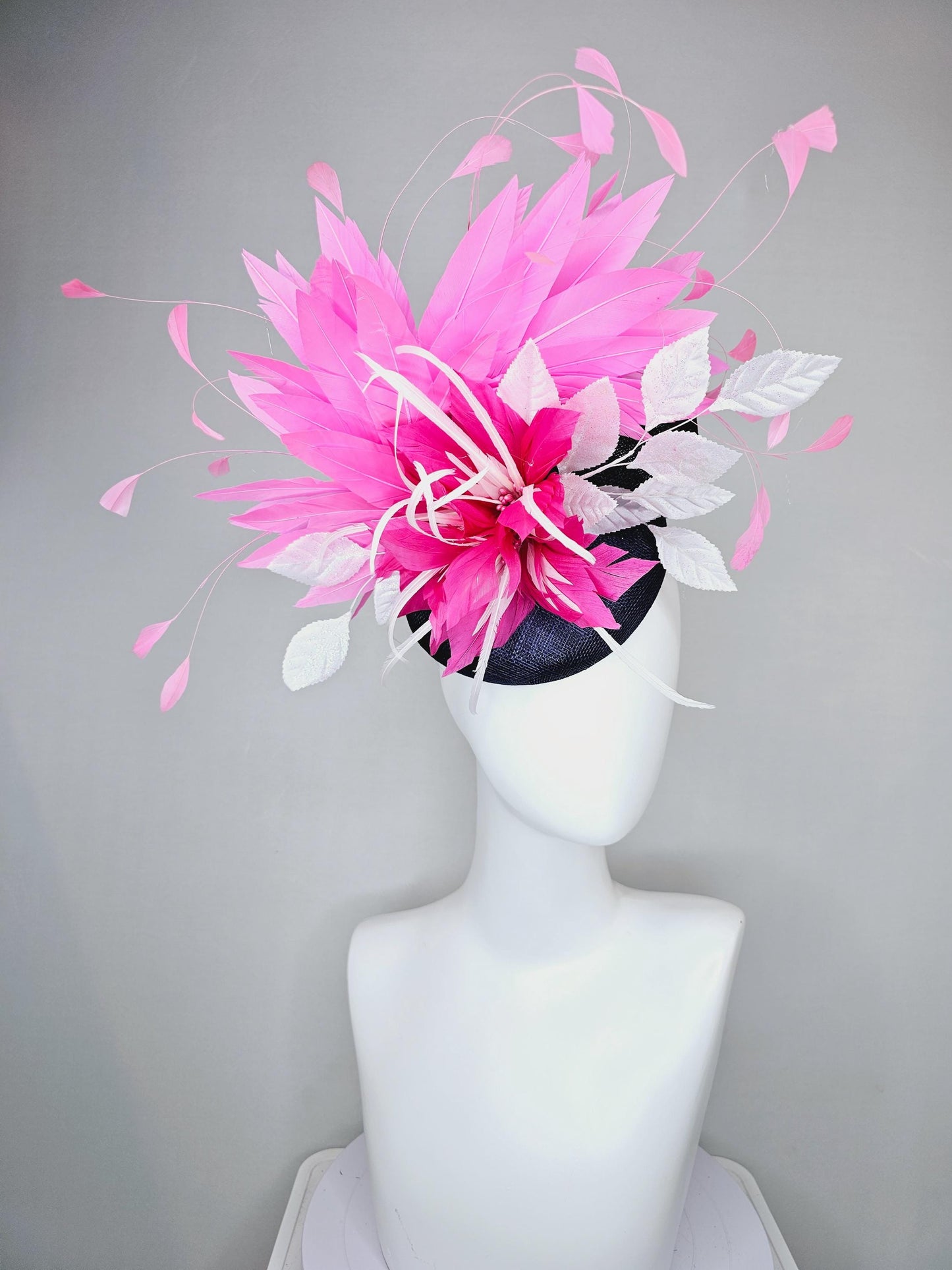 kentucky derby hat fascinator navy blue sinamay with hot pink feather flower, white velvet leaves and blush pink branching feathers