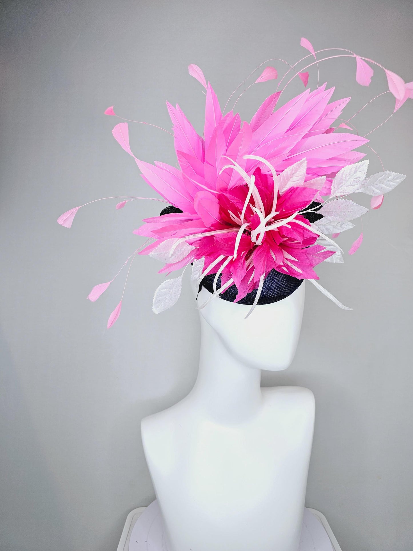 kentucky derby hat fascinator navy blue sinamay with hot pink feather flower, white velvet leaves and blush pink branching feathers