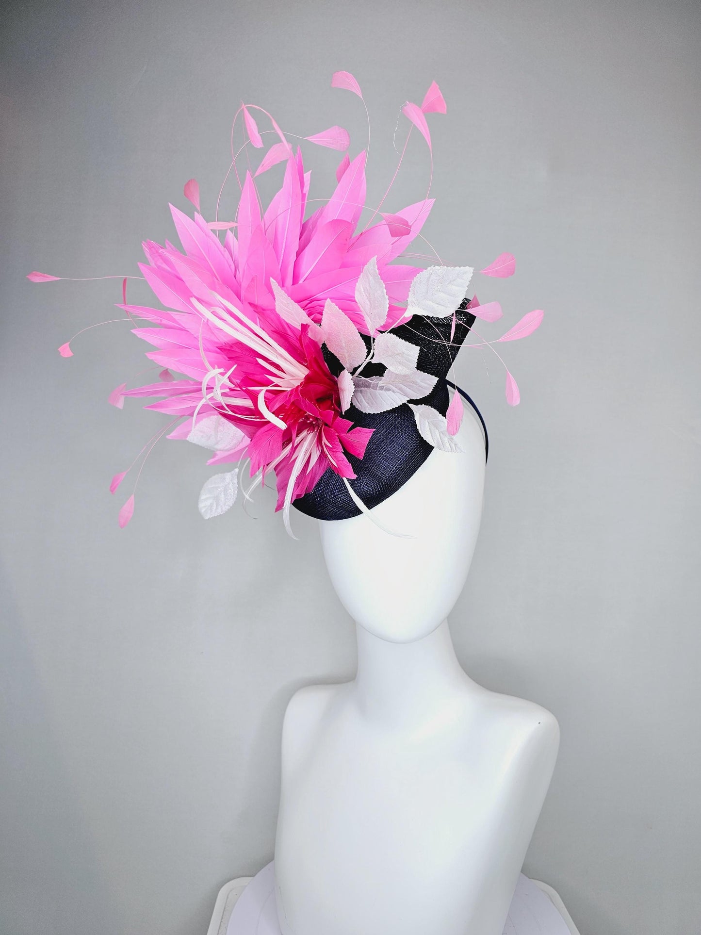 kentucky derby hat fascinator navy blue sinamay with hot pink feather flower, white velvet leaves and blush pink branching feathers