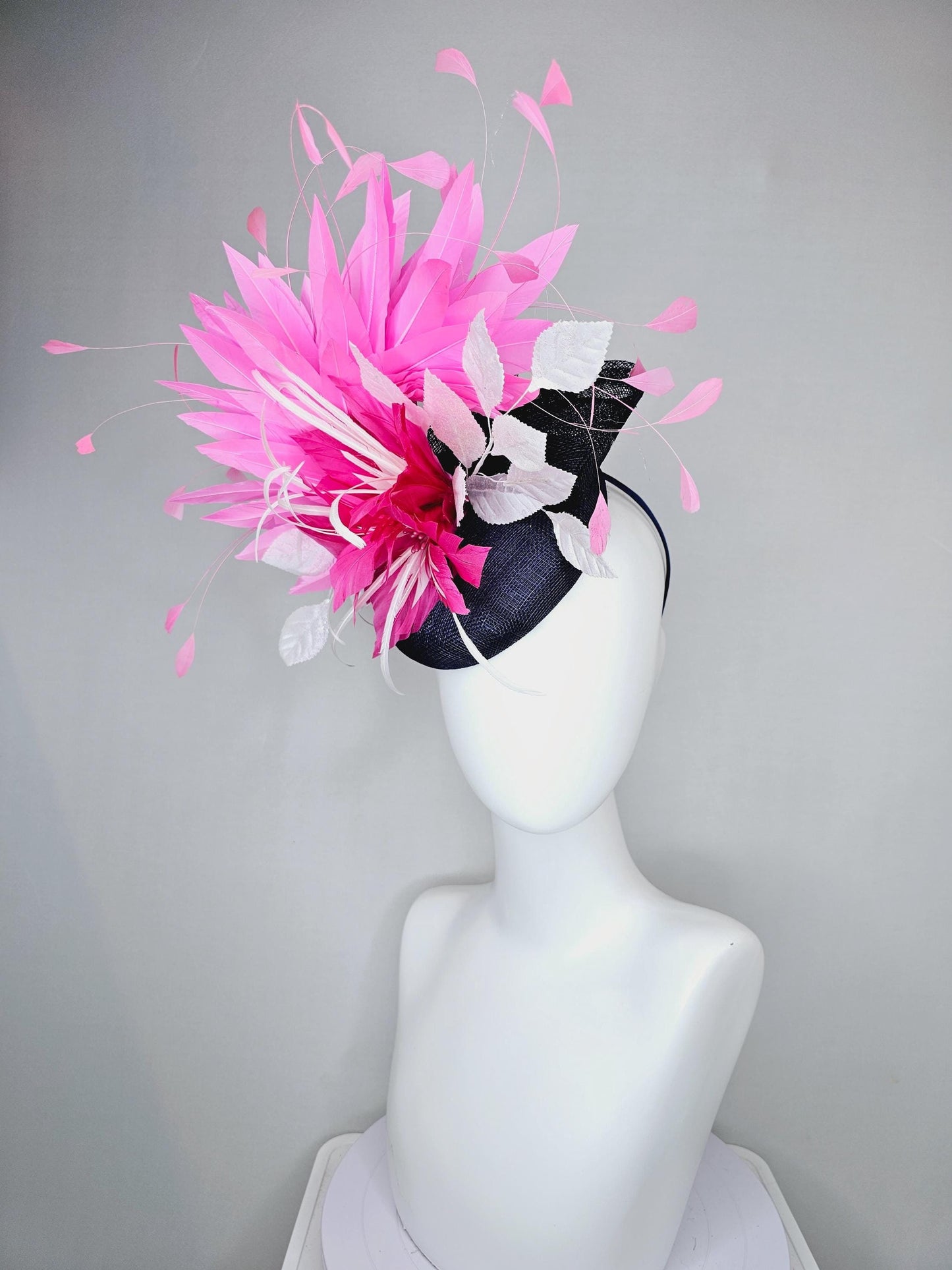 kentucky derby hat fascinator navy blue sinamay with hot pink feather flower, white velvet leaves and blush pink branching feathers