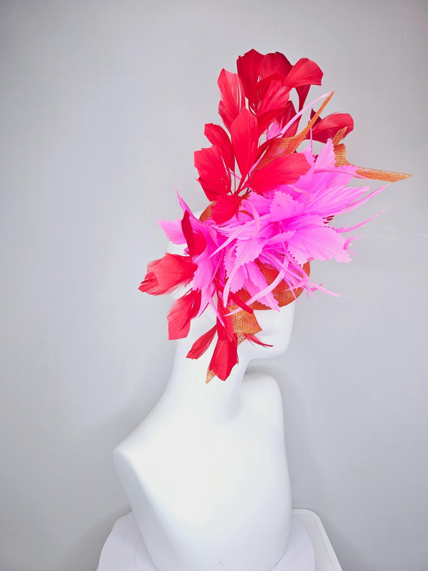 kentucky derby hat fascinator orange sinamay with curls and fluffy zigzag bright pink feather flower, red branching feathers