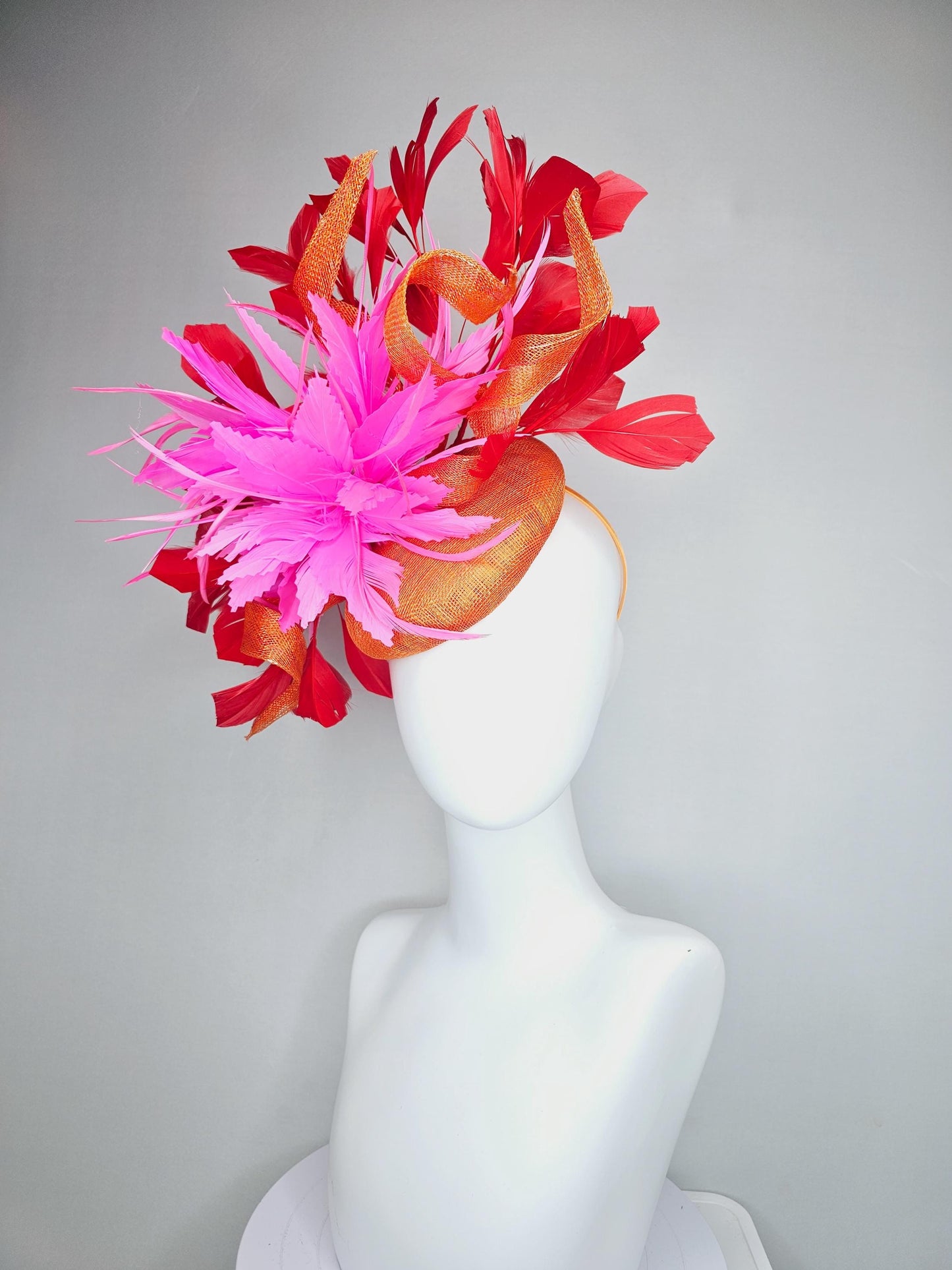 kentucky derby hat fascinator orange sinamay with curls and fluffy zigzag bright pink feather flower, red branching feathers