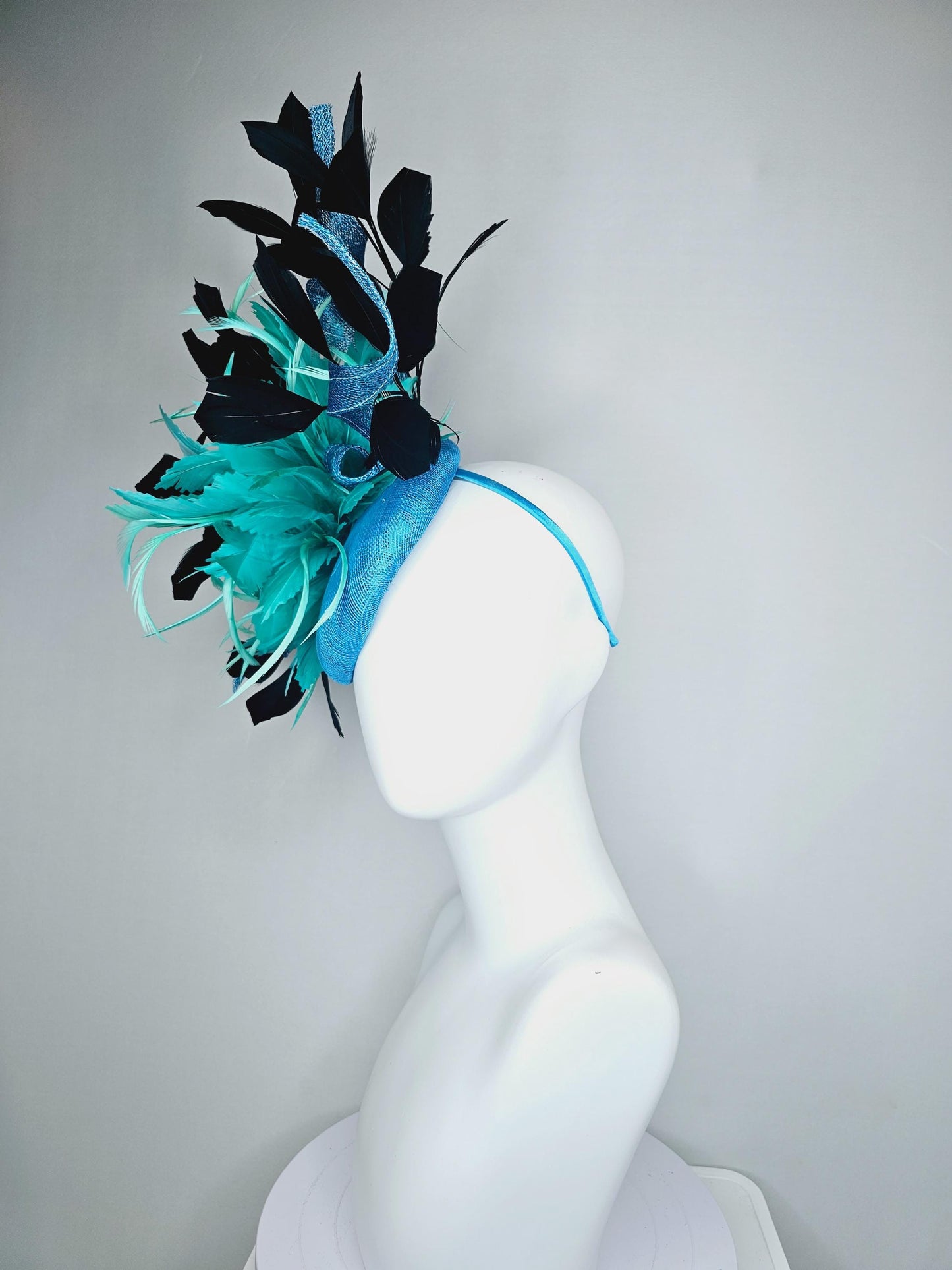 kentucky derby hat fascinator sky blue sinamay with curls, fluffy zigzag turquoise blue mint green feather flower, black branching feathers