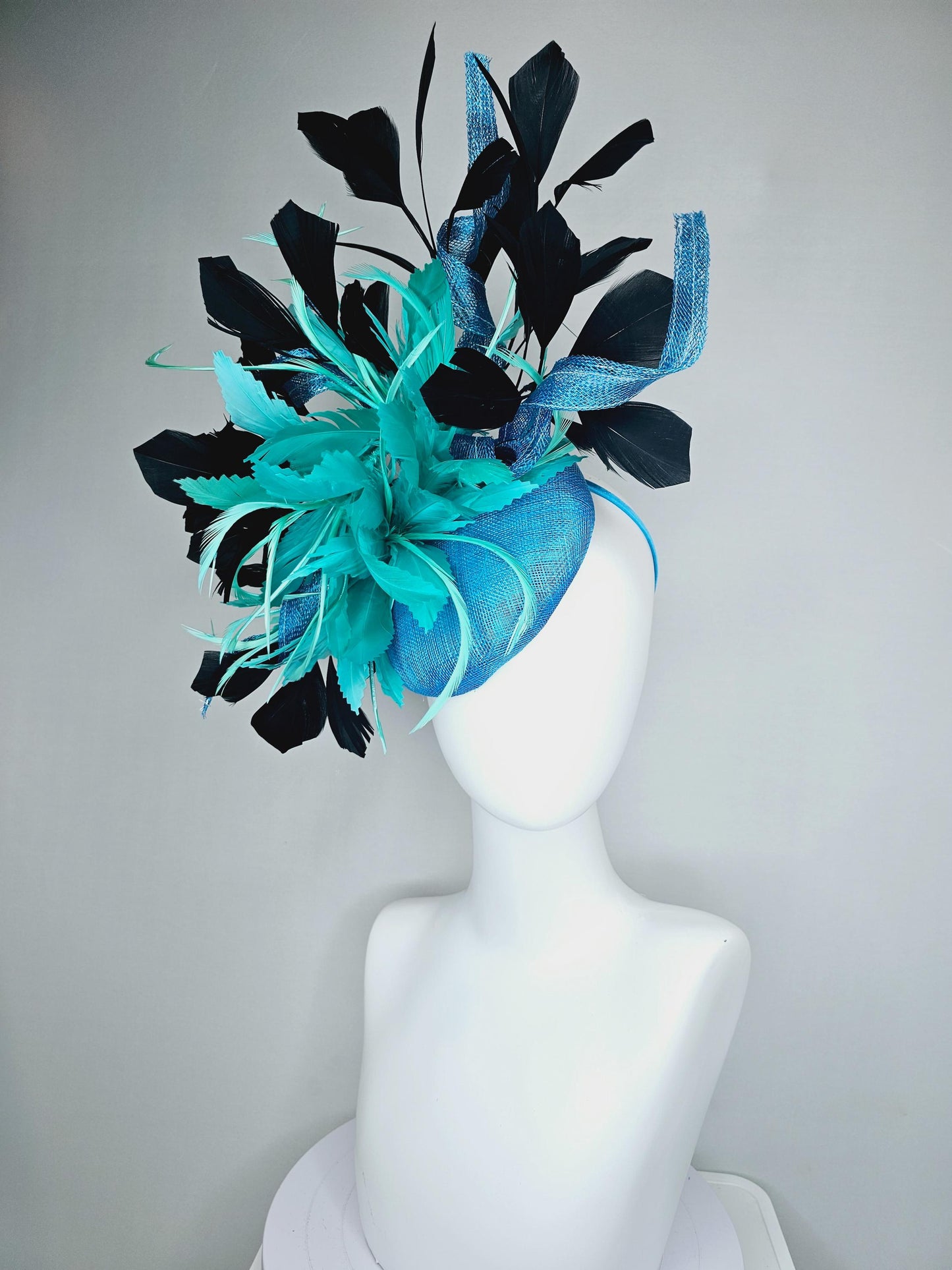 kentucky derby hat fascinator sky blue sinamay with curls, fluffy zigzag turquoise blue mint green feather flower, black branching feathers