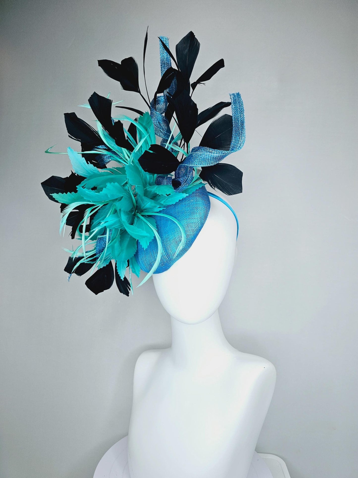 kentucky derby hat fascinator sky blue sinamay with curls, fluffy zigzag turquoise blue mint green feather flower, black branching feathers