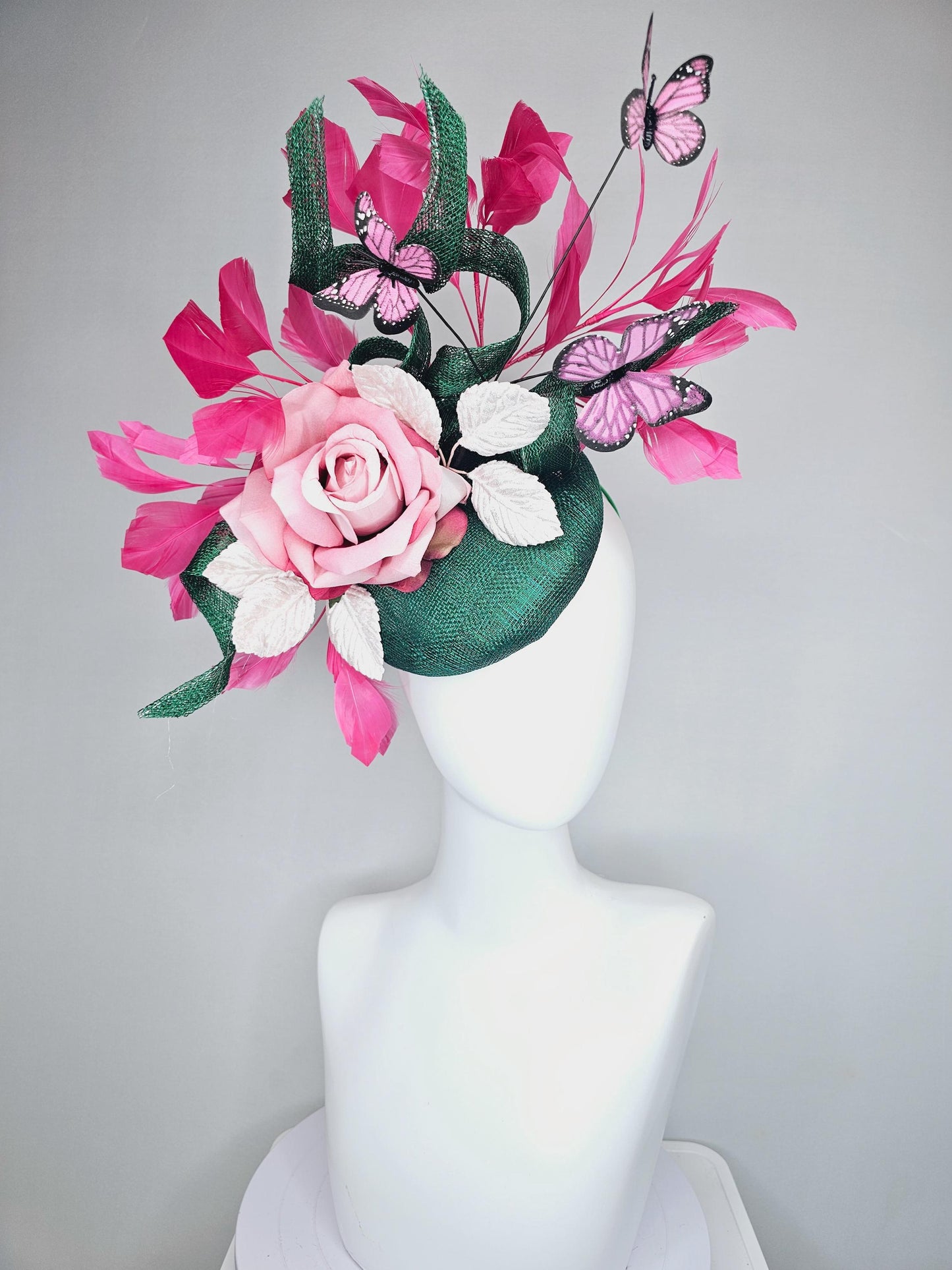 kentucky derby hat fascinator dark green sinamay w/ curls, pink ombre satin rose,white leaves,pink branching feathers,pink black butterflies