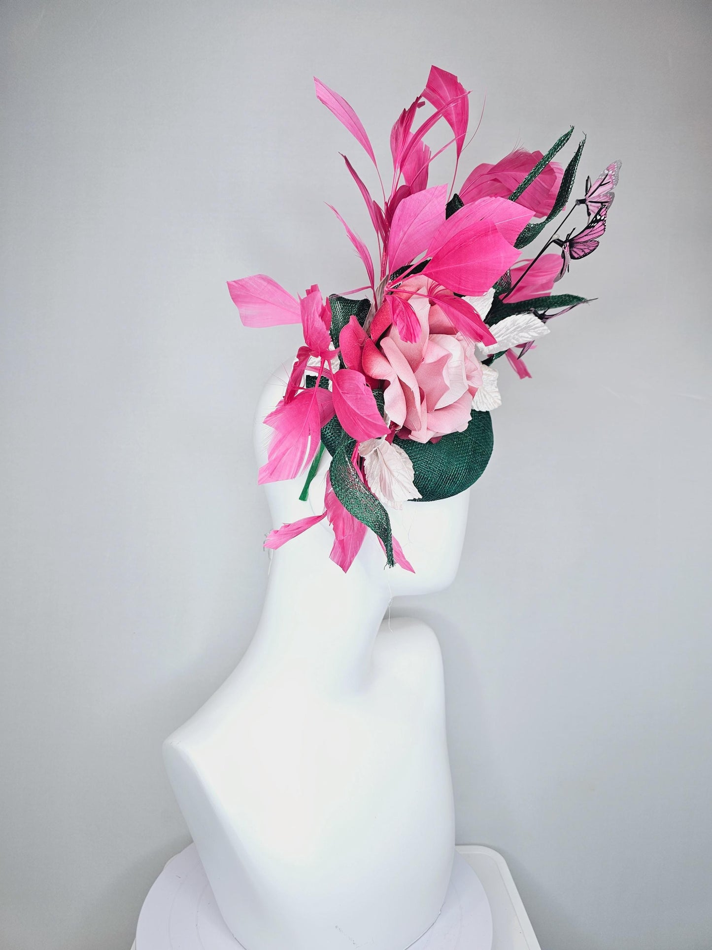 kentucky derby hat fascinator dark green sinamay w/ curls, pink ombre satin rose,white leaves,pink branching feathers,pink black butterflies