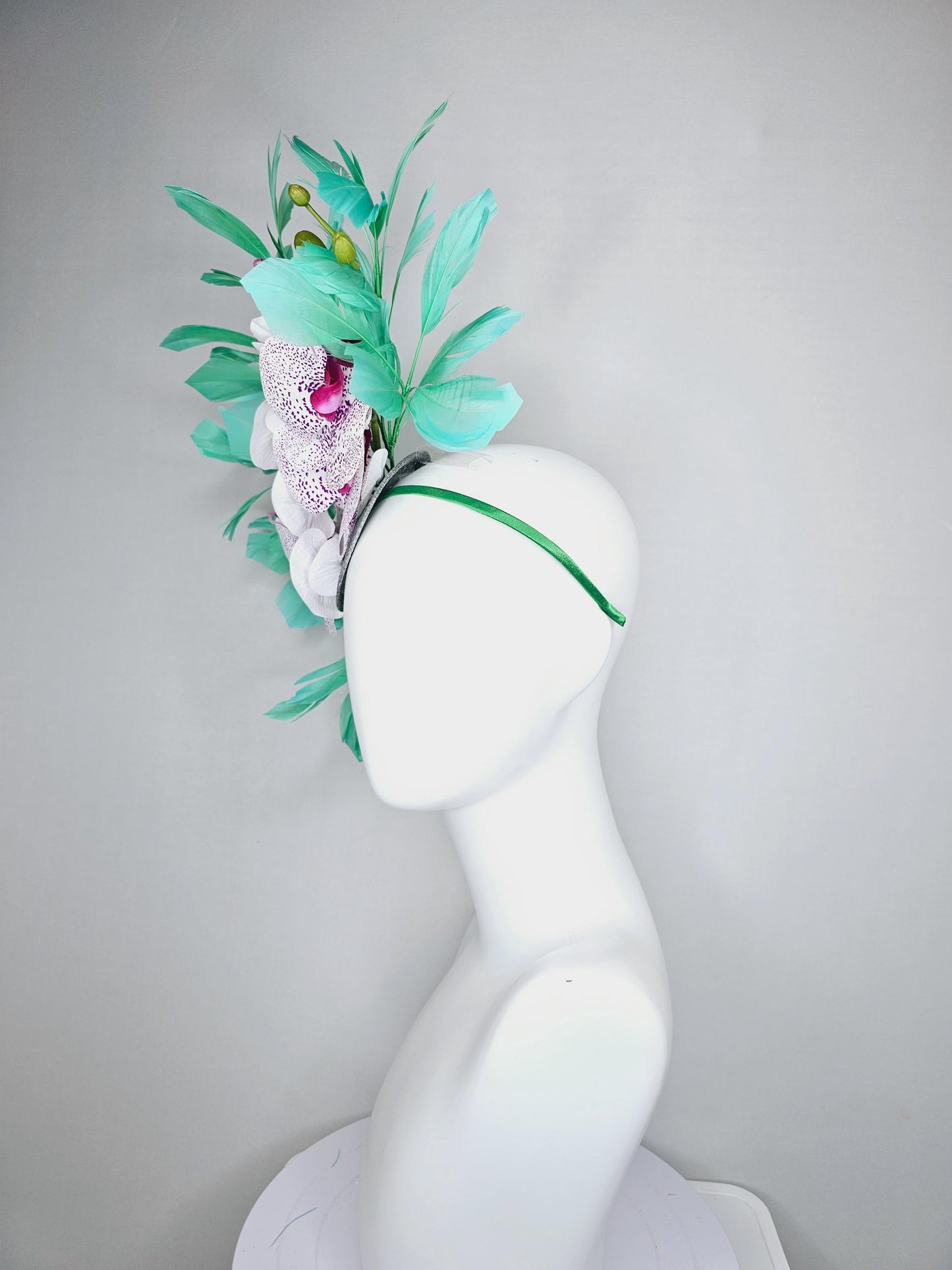 kentucky derby hat fascinator large white and purple satin silk orchid flowers, bright mint green branching feathers