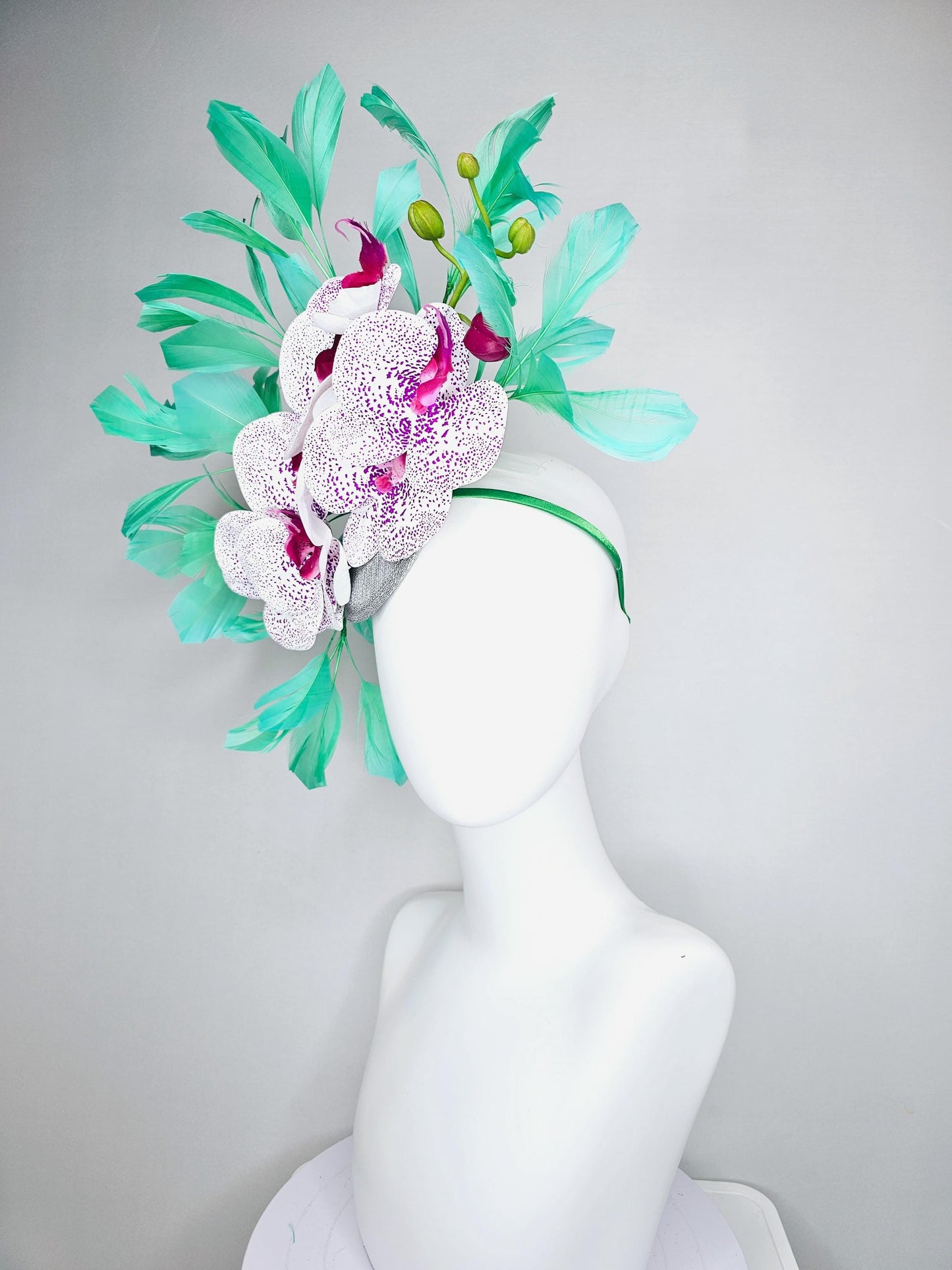 kentucky derby hat fascinator large white and purple satin silk orchid flowers, bright mint green branching feathers