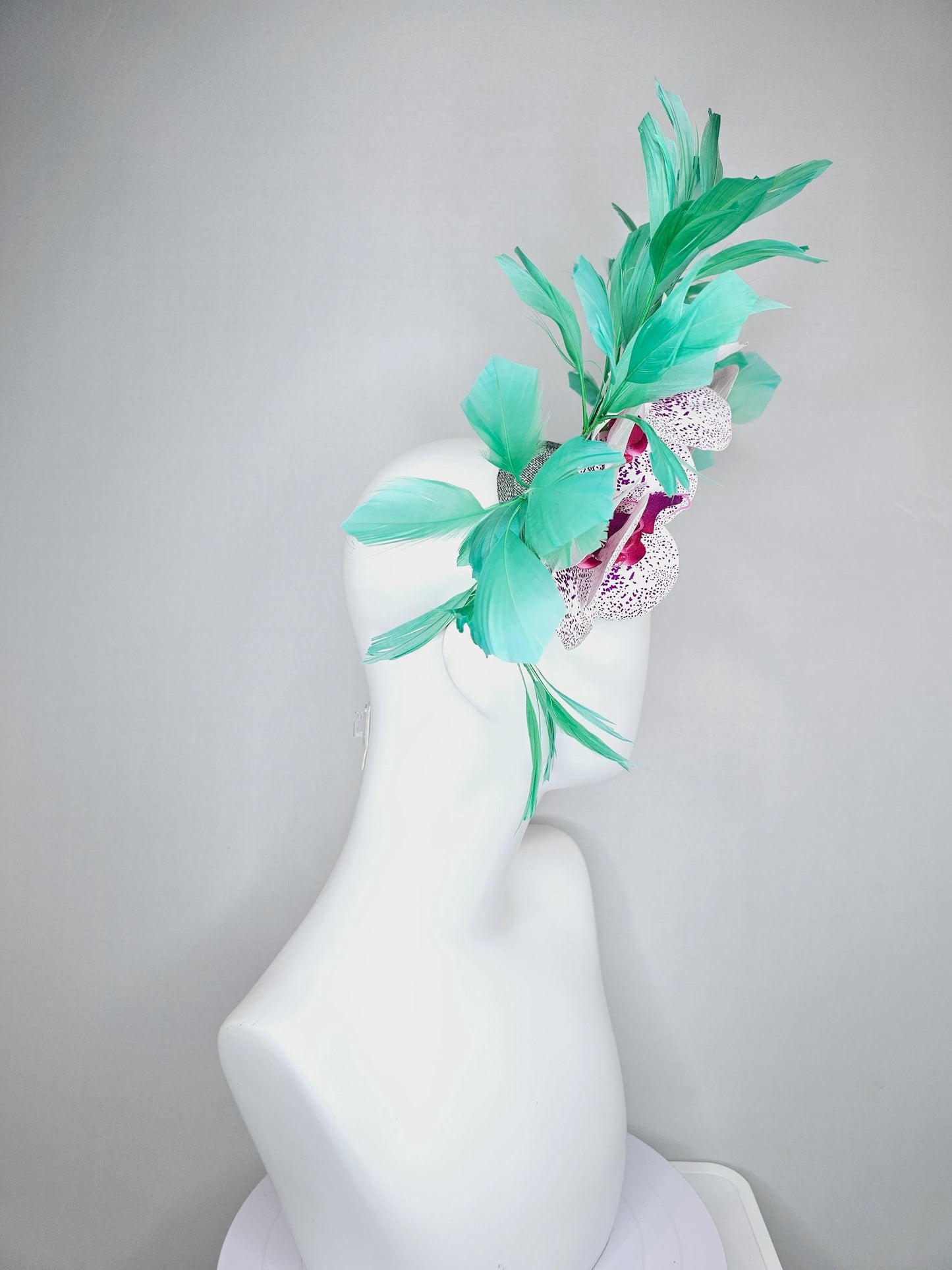 kentucky derby hat fascinator large white and purple satin silk orchid flowers, bright mint green branching feathers