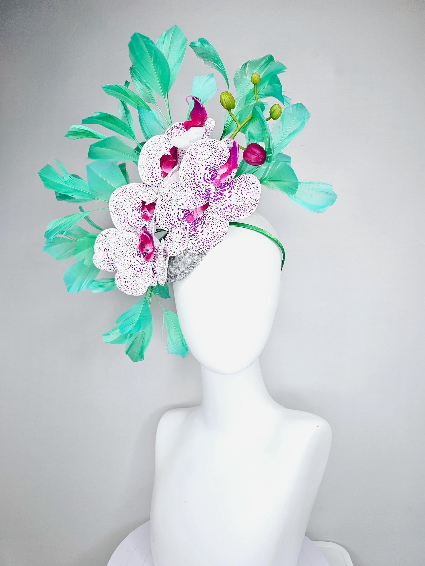 kentucky derby hat fascinator large white and purple satin silk orchid flowers, bright mint green branching feathers