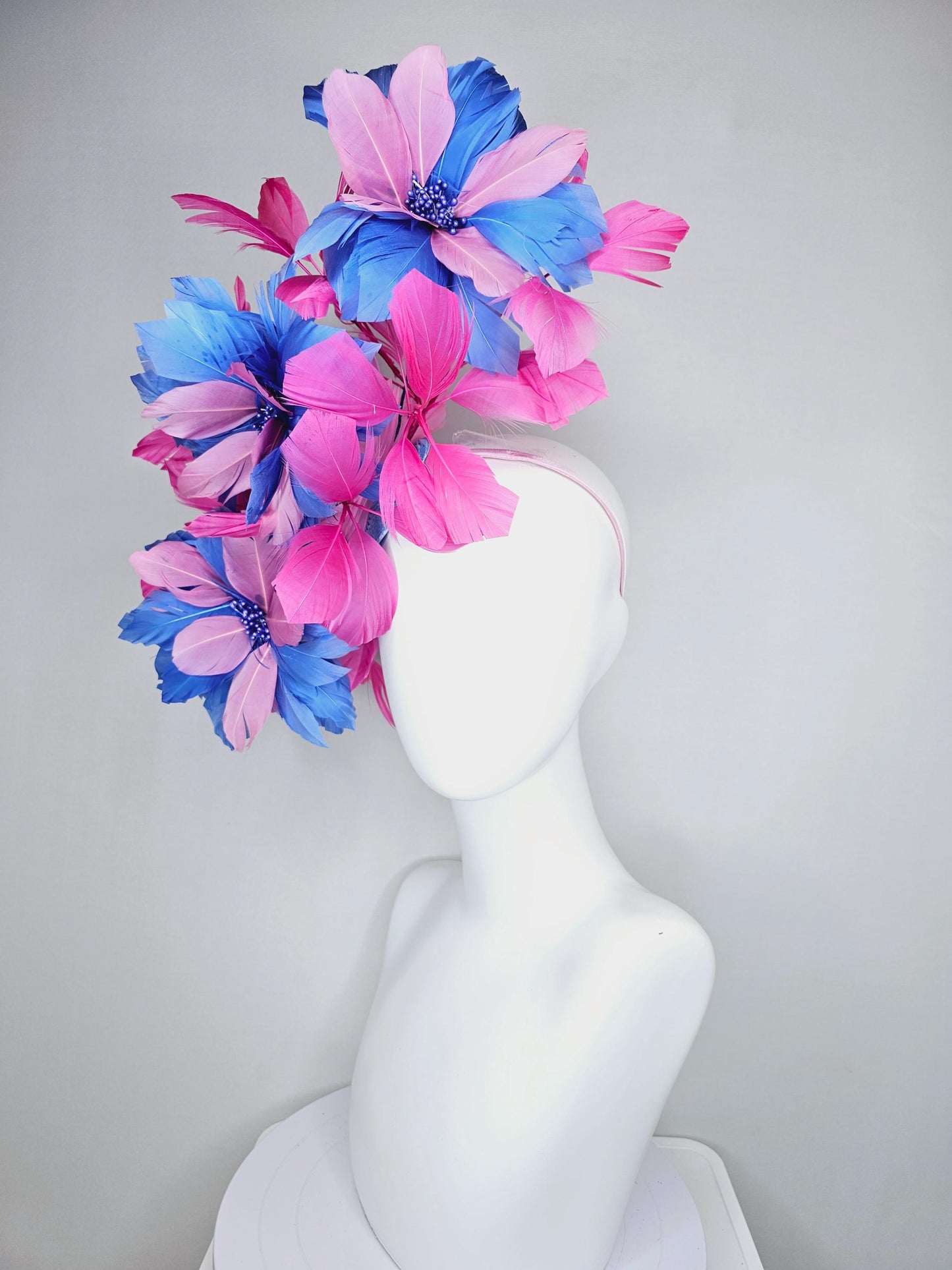 kentucky derby hat fascinator with large cobalt royal blue light pink feather flowers and pink branching feathers