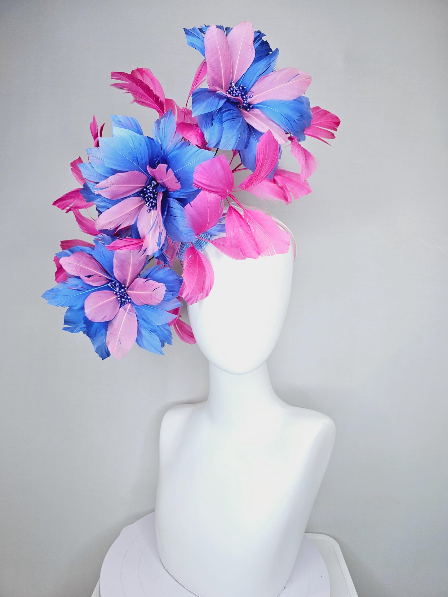 kentucky derby hat fascinator with large cobalt royal blue light pink feather flowers and pink branching feathers