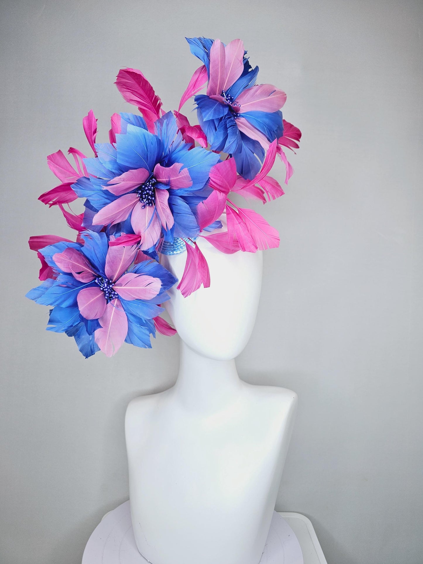 kentucky derby hat fascinator with large cobalt royal blue light pink feather flowers and pink branching feathers