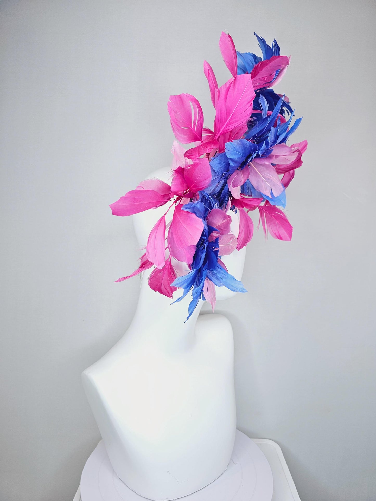 kentucky derby hat fascinator with large cobalt royal blue light pink feather flowers and pink branching feathers