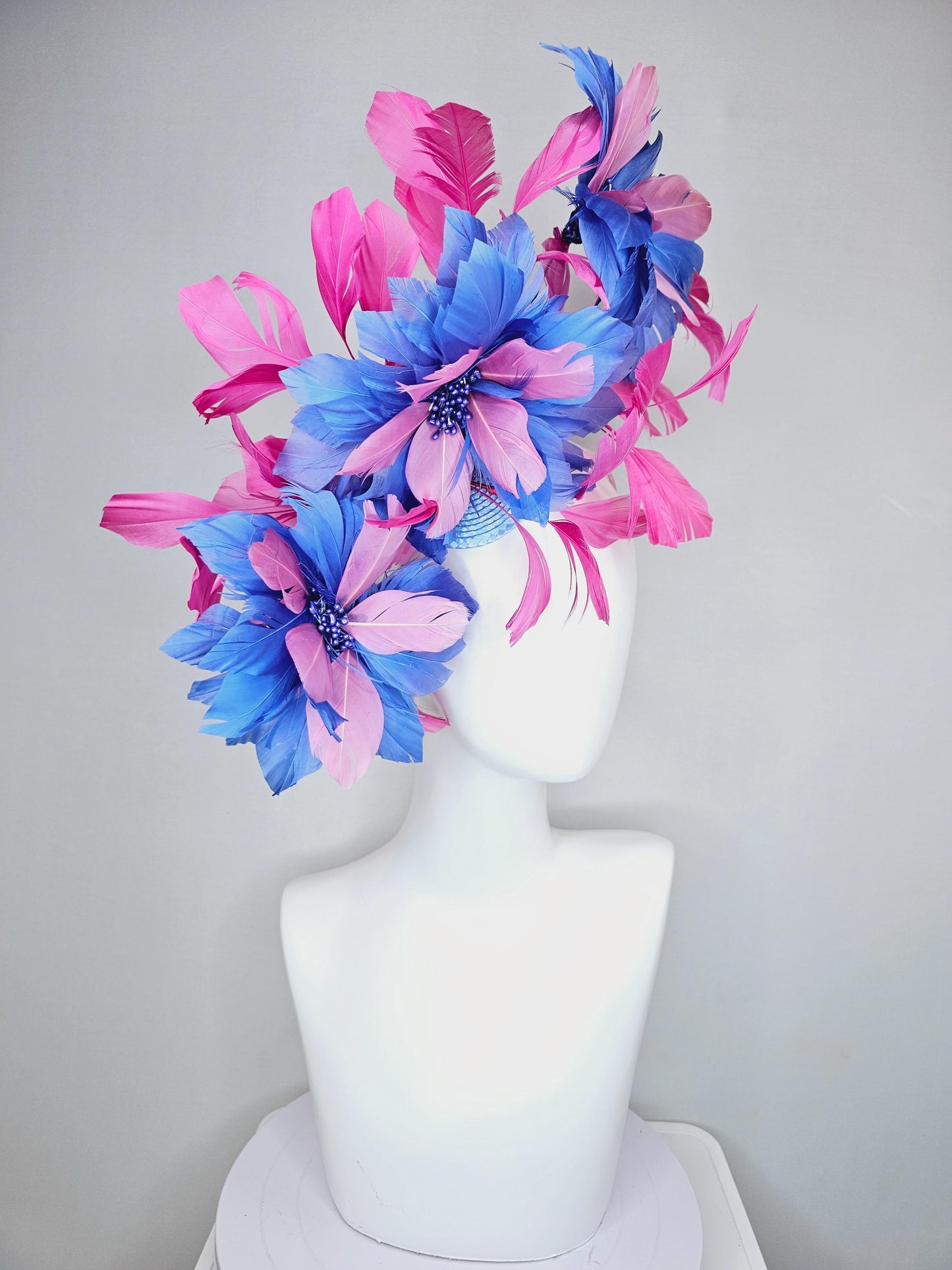 kentucky derby hat fascinator with large cobalt royal blue light pink feather flowers and pink branching feathers