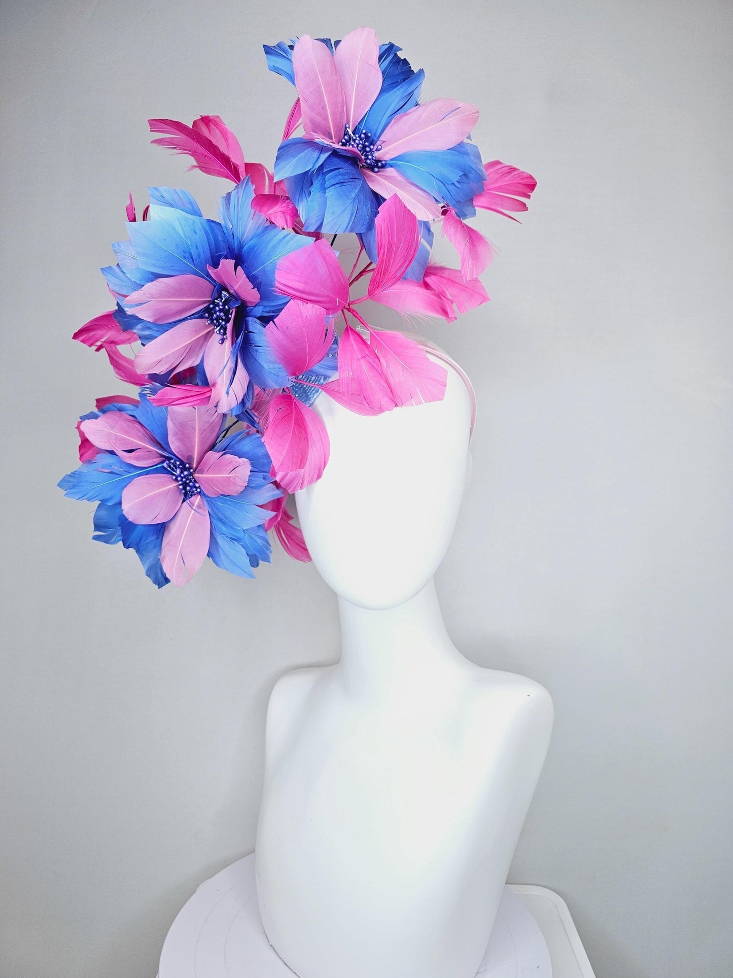 kentucky derby hat fascinator with large cobalt royal blue light pink feather flowers and pink branching feathers