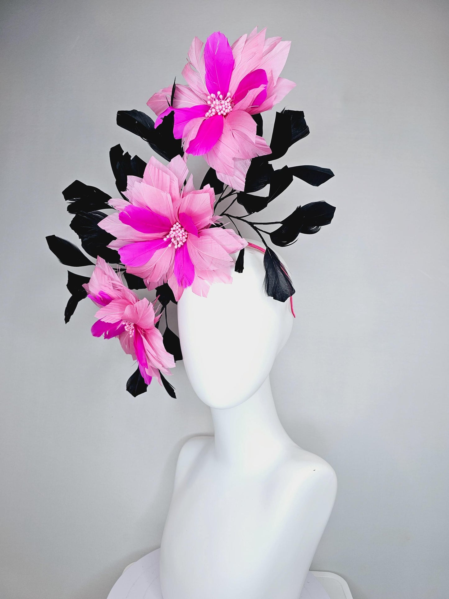 kentucky derby hat fascinator with large light pink bright fuchsia pink feather flowers and black branching feathers