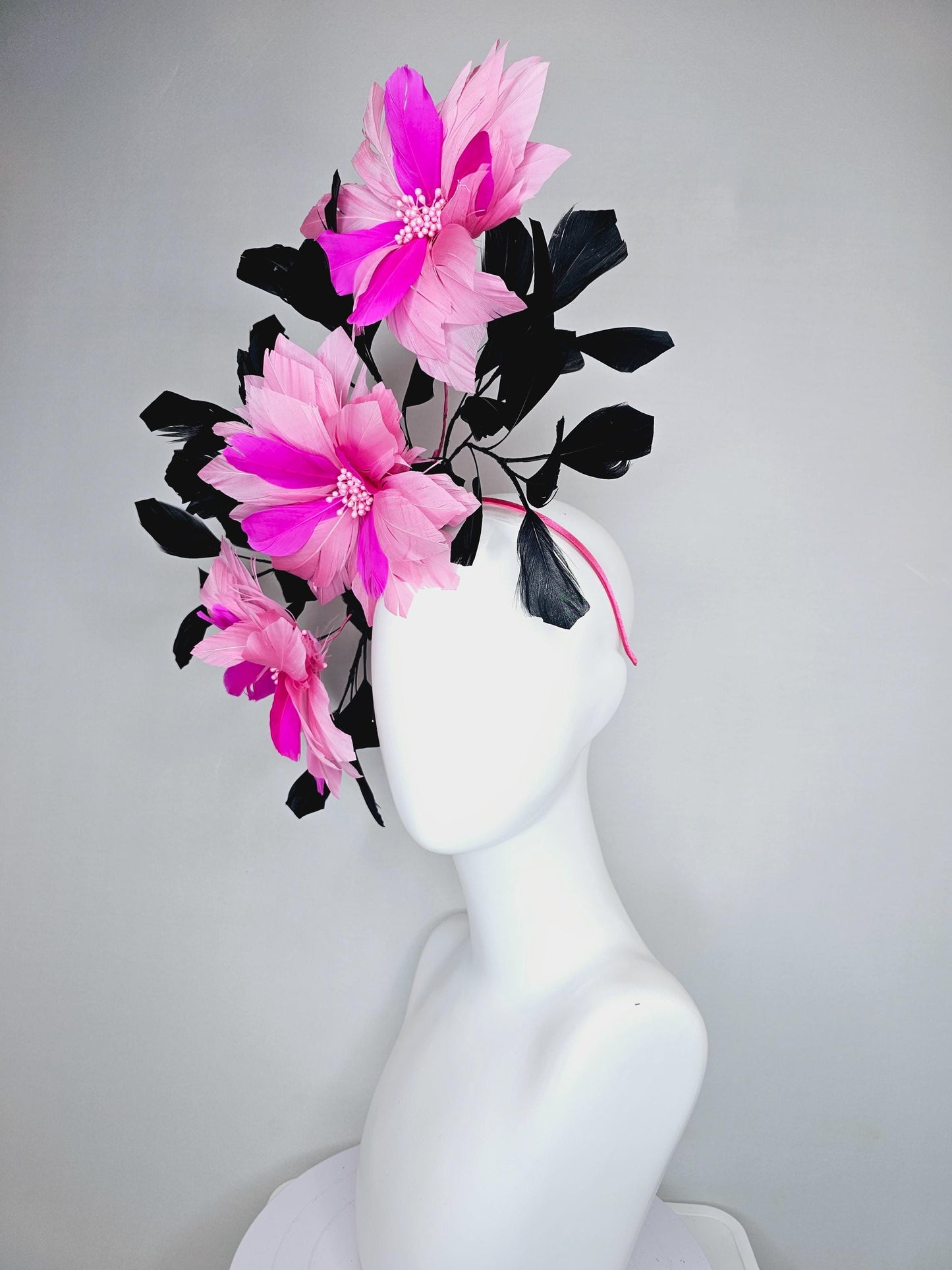 kentucky derby hat fascinator with large light pink bright fuchsia pink feather flowers and black branching feathers