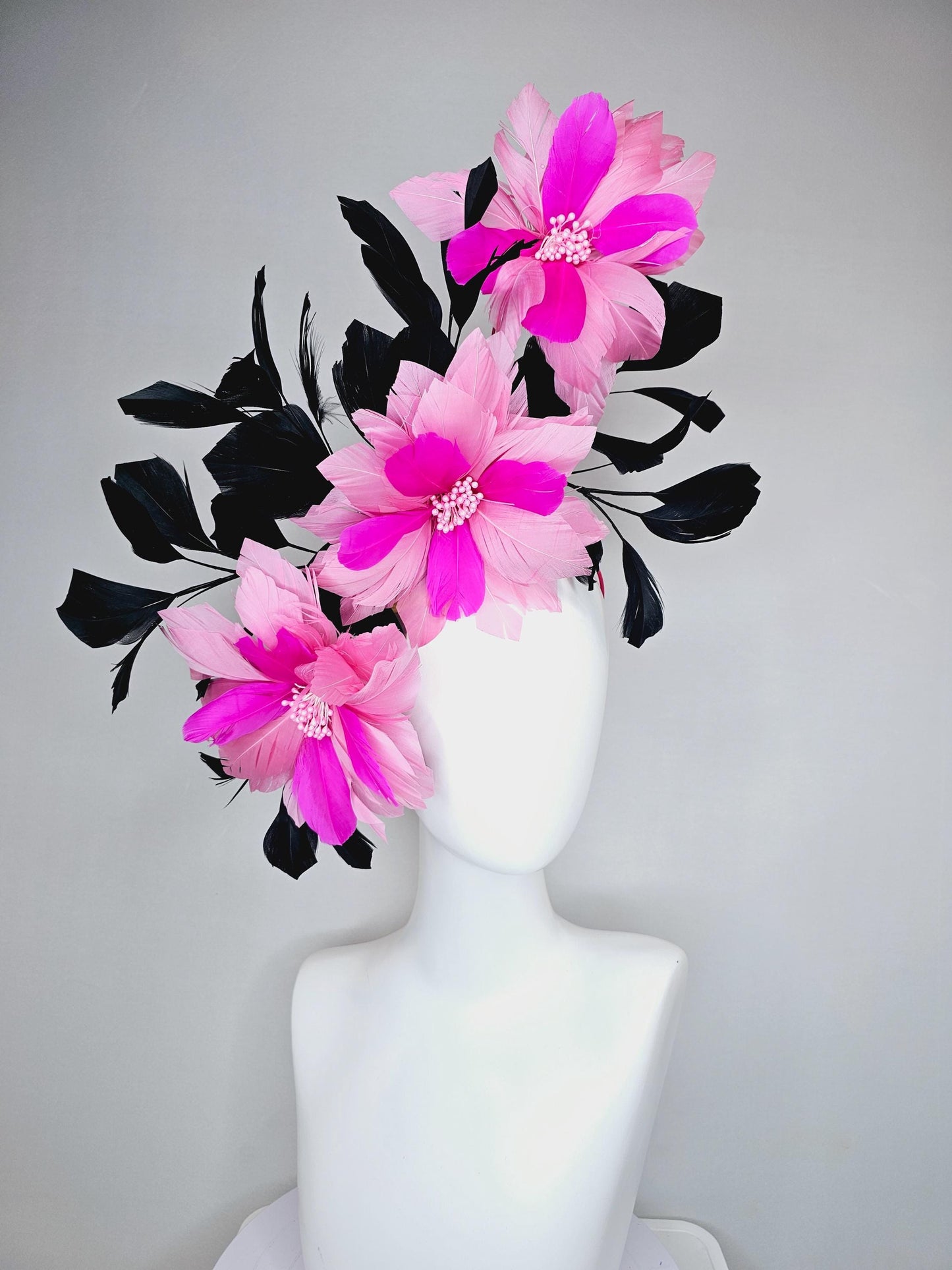 kentucky derby hat fascinator with large light pink bright fuchsia pink feather flowers and black branching feathers