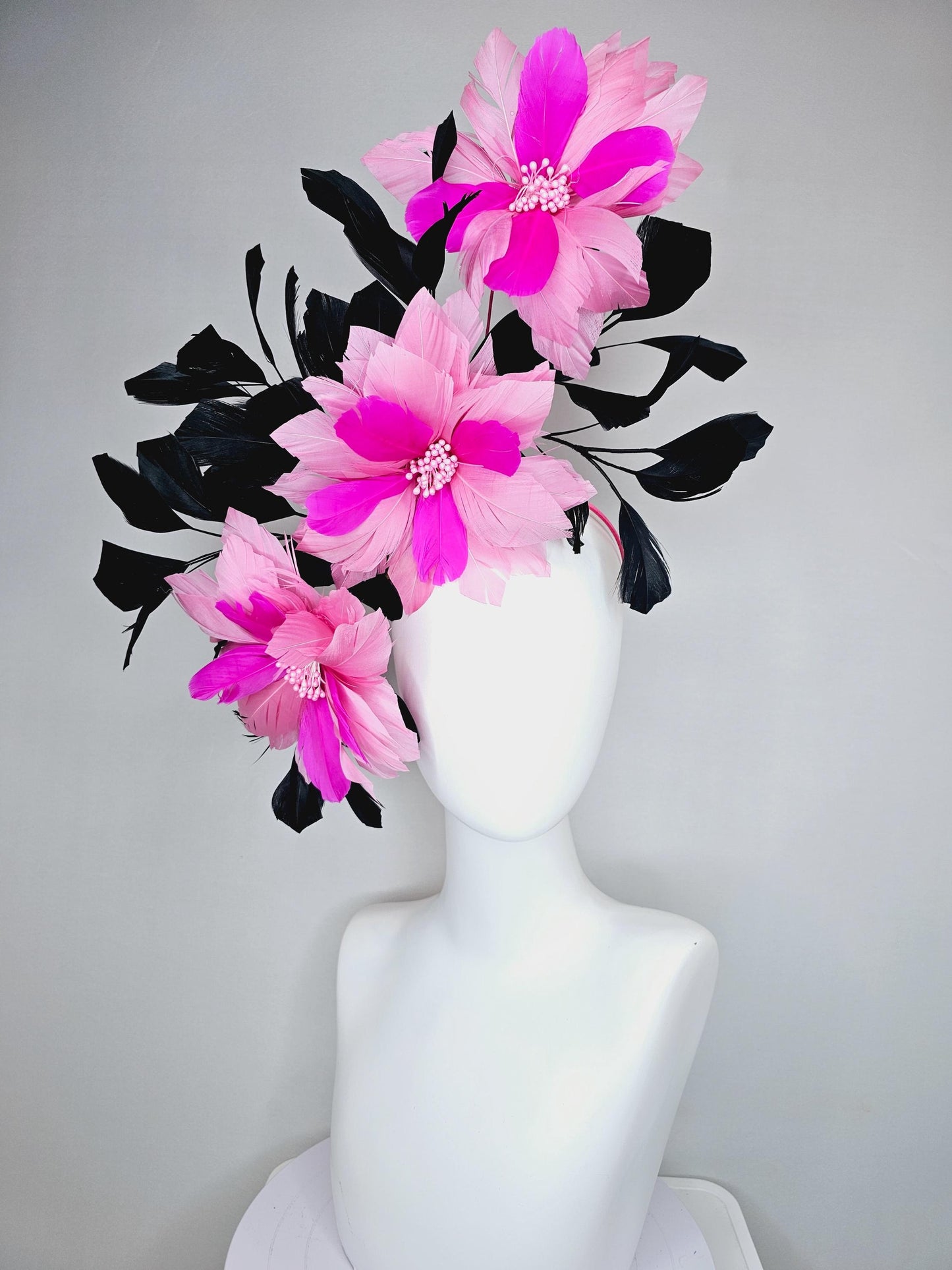 kentucky derby hat fascinator with large light pink bright fuchsia pink feather flowers and black branching feathers