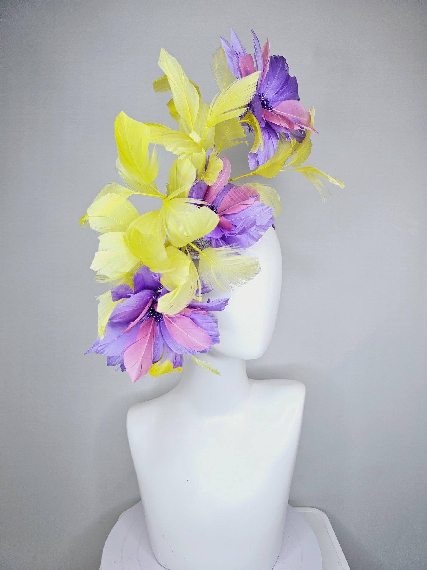 kentucky derby hat fascinator with large lavender purple light pink feather flowers and yellow branching feathers