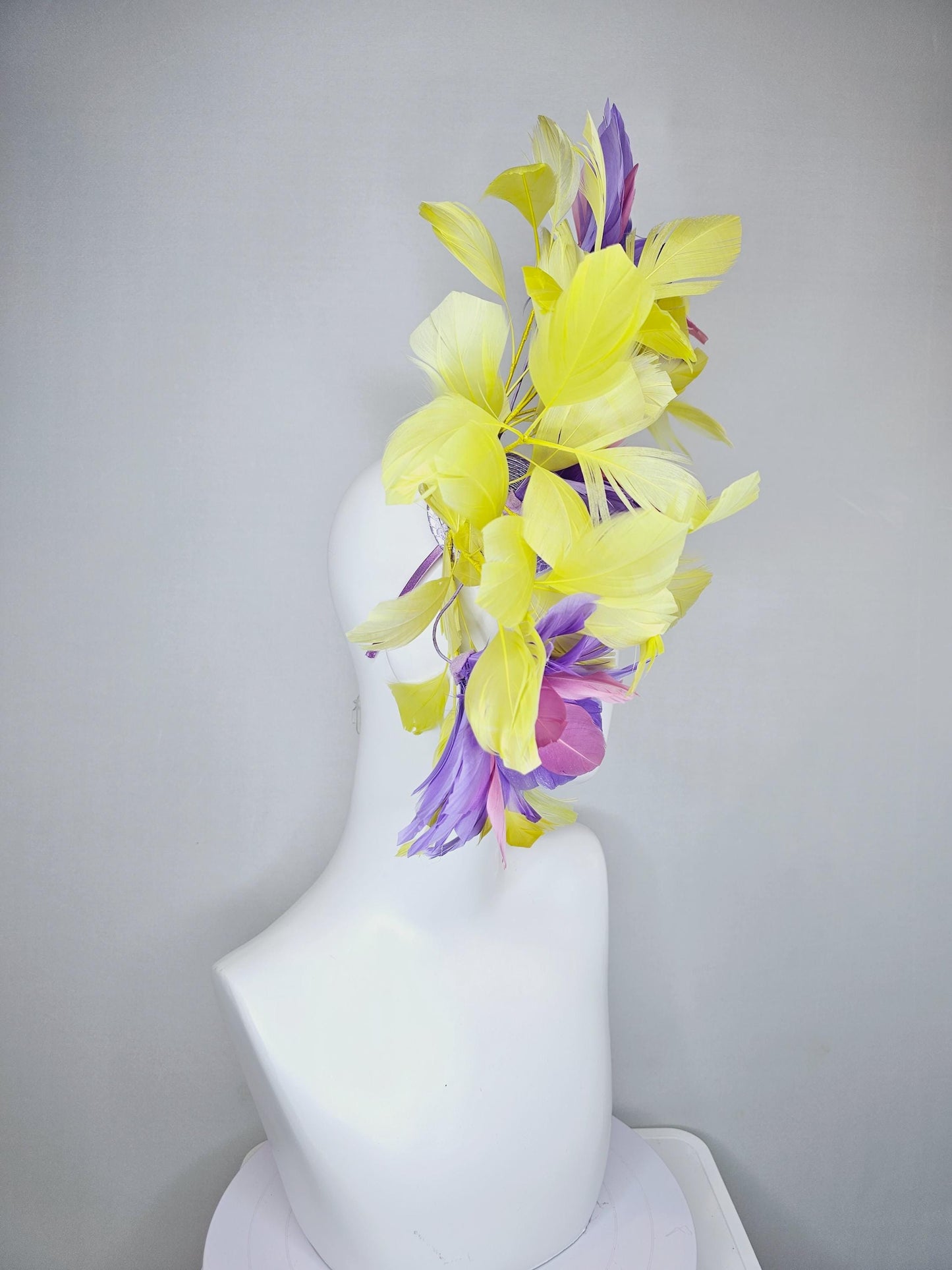 kentucky derby hat fascinator with large lavender purple light pink feather flowers and yellow branching feathers