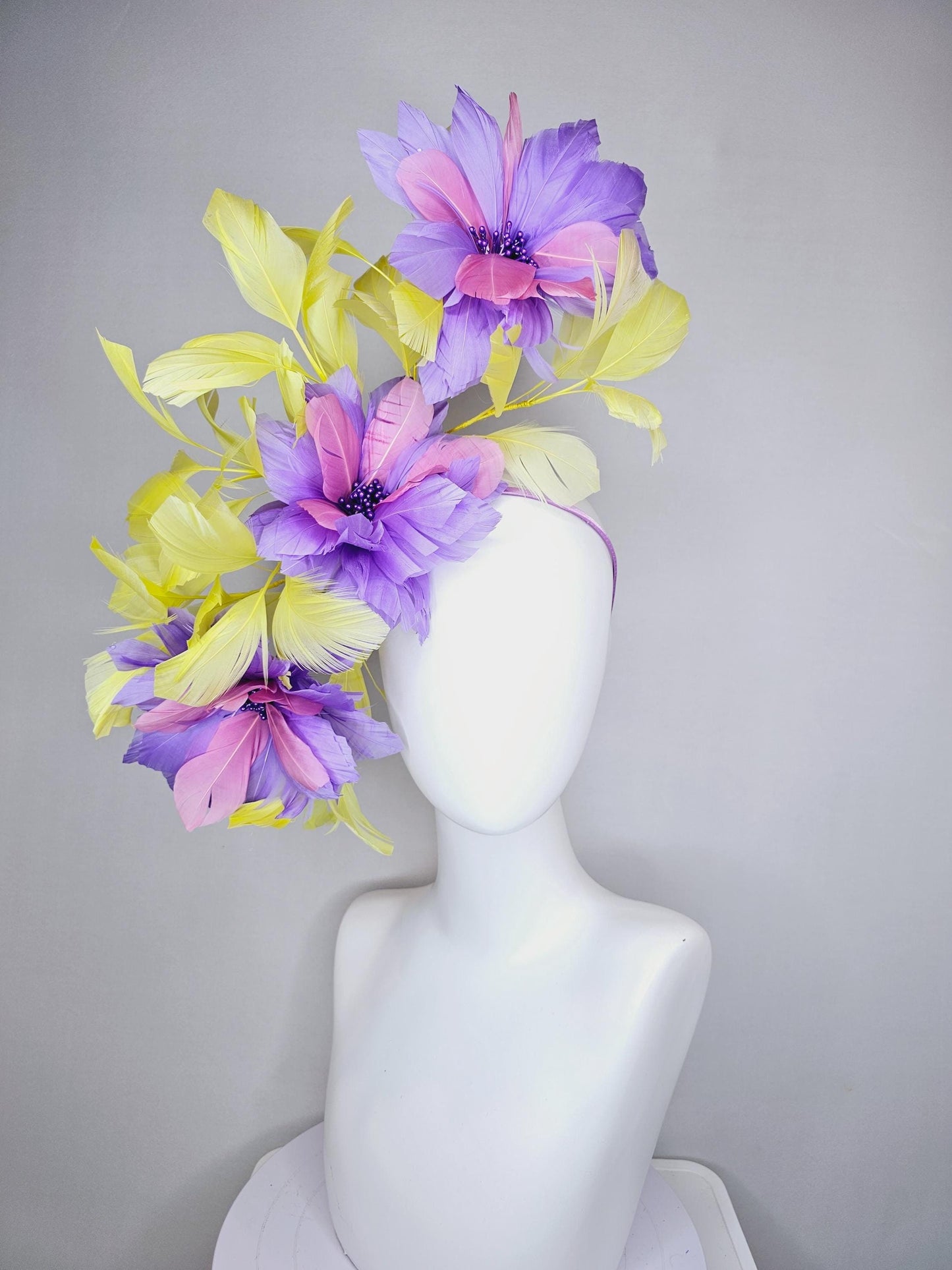 kentucky derby hat fascinator with large lavender purple light pink feather flowers and yellow branching feathers