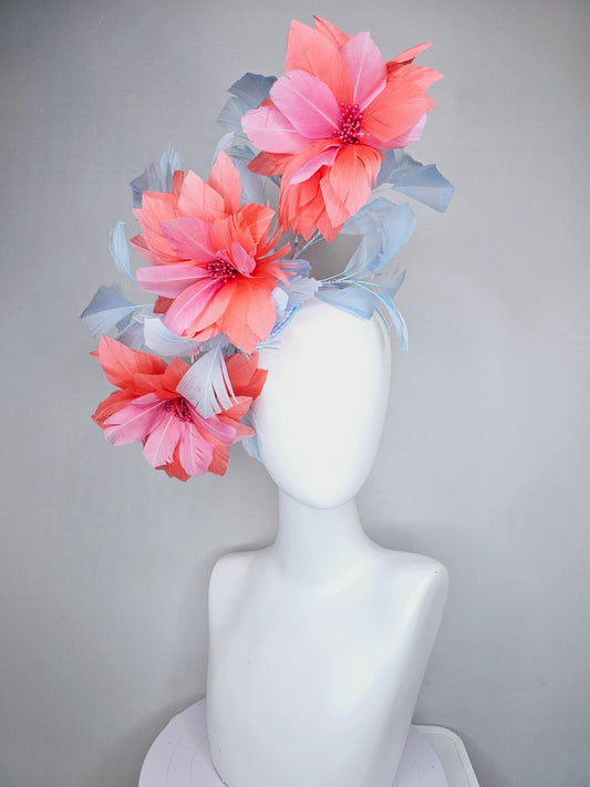 kentucky derby hat fascinator with large coral orange light pink feather flowers and light baby blue branching feathers