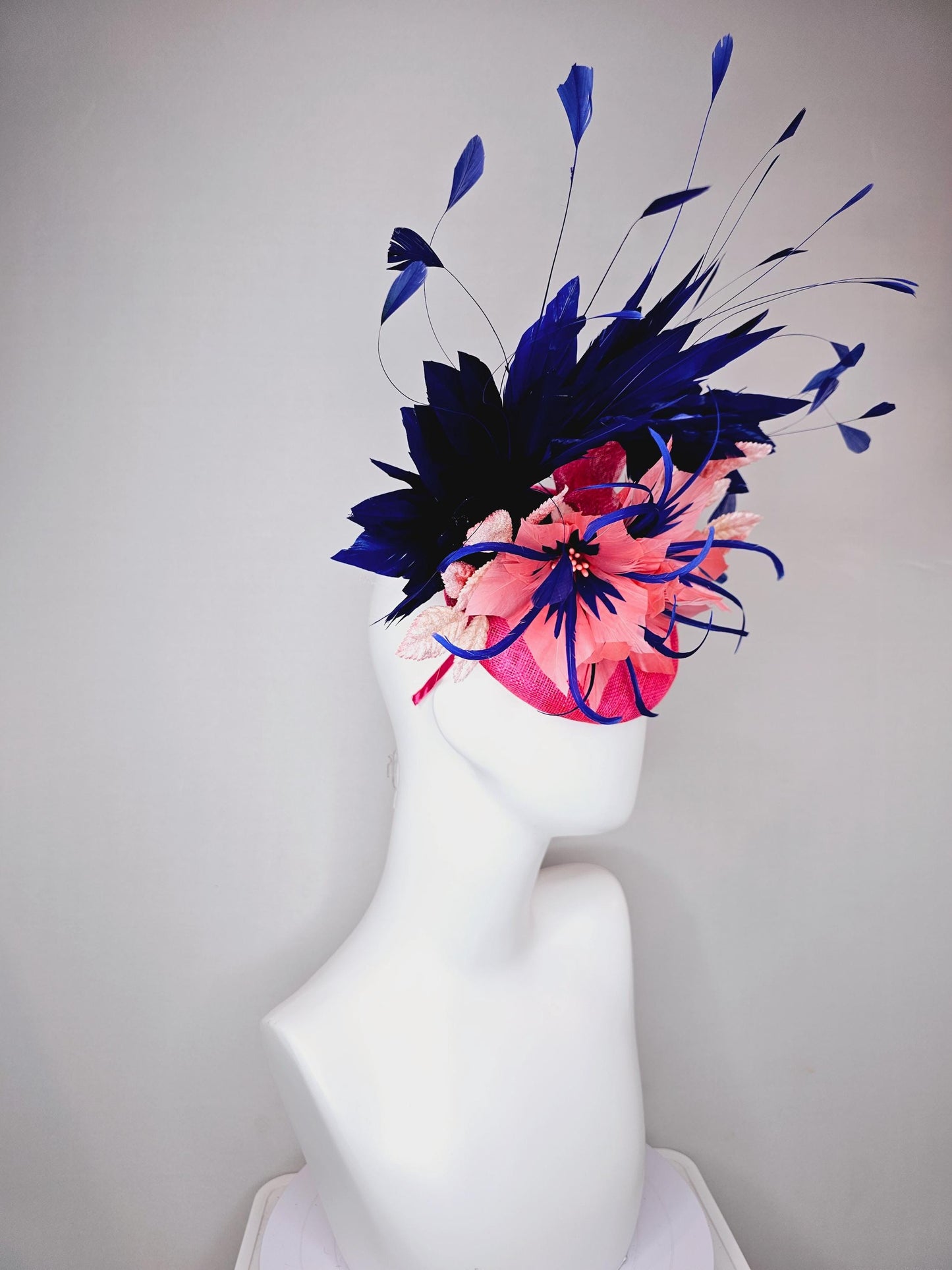 kentucky derby hat fascinator raspberry pink sinamay with peach pink and royal blue feather flower,peach leaves,navy blue branching feathers