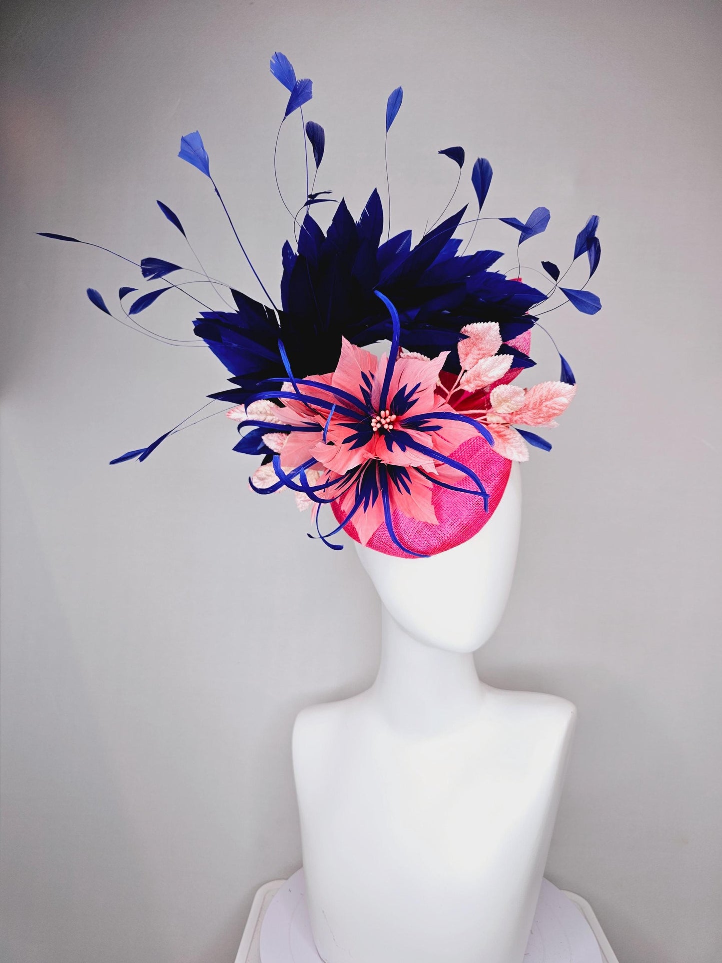 kentucky derby hat fascinator raspberry pink sinamay with peach pink and royal blue feather flower,peach leaves,navy blue branching feathers