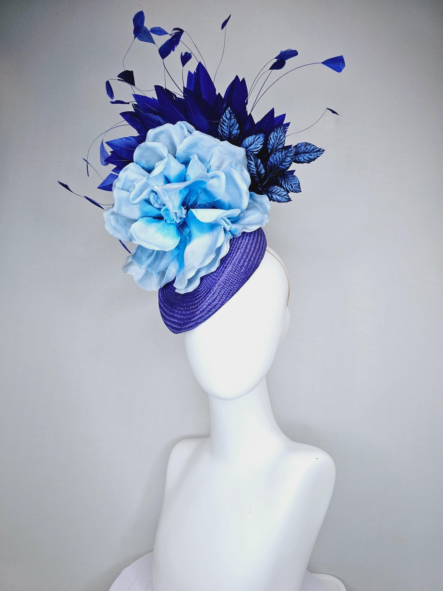 kentucky derby hat fascinator royal blue woven base with large light blue satin silk rose flower and midnight navy blue branching feathers