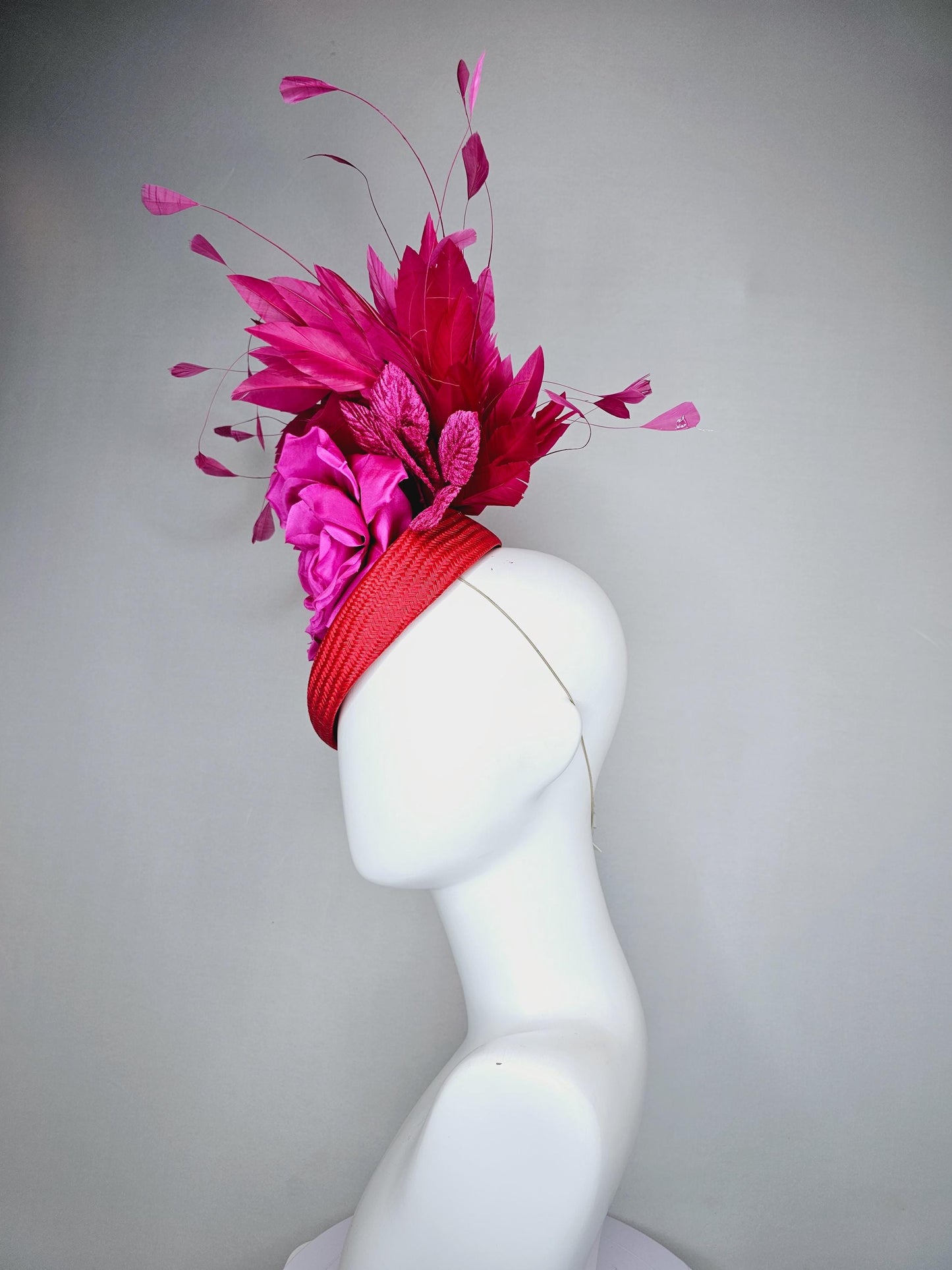 kentucky derby hat fascinator bright red woven base with large fuchsia pink satin silk rose flower and hot pink branching feathers