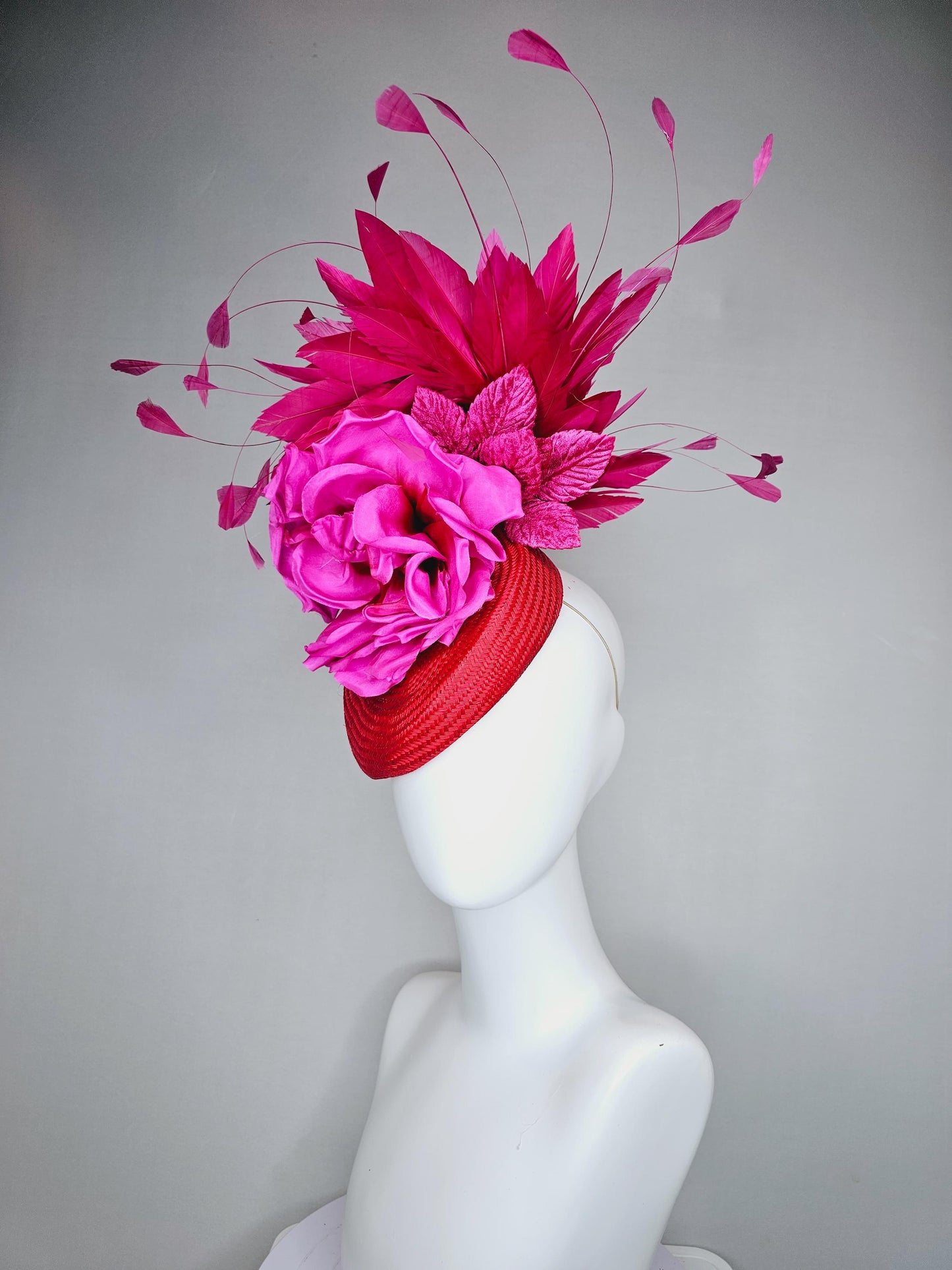 kentucky derby hat fascinator bright red woven base with large fuchsia pink satin silk rose flower and hot pink branching feathers