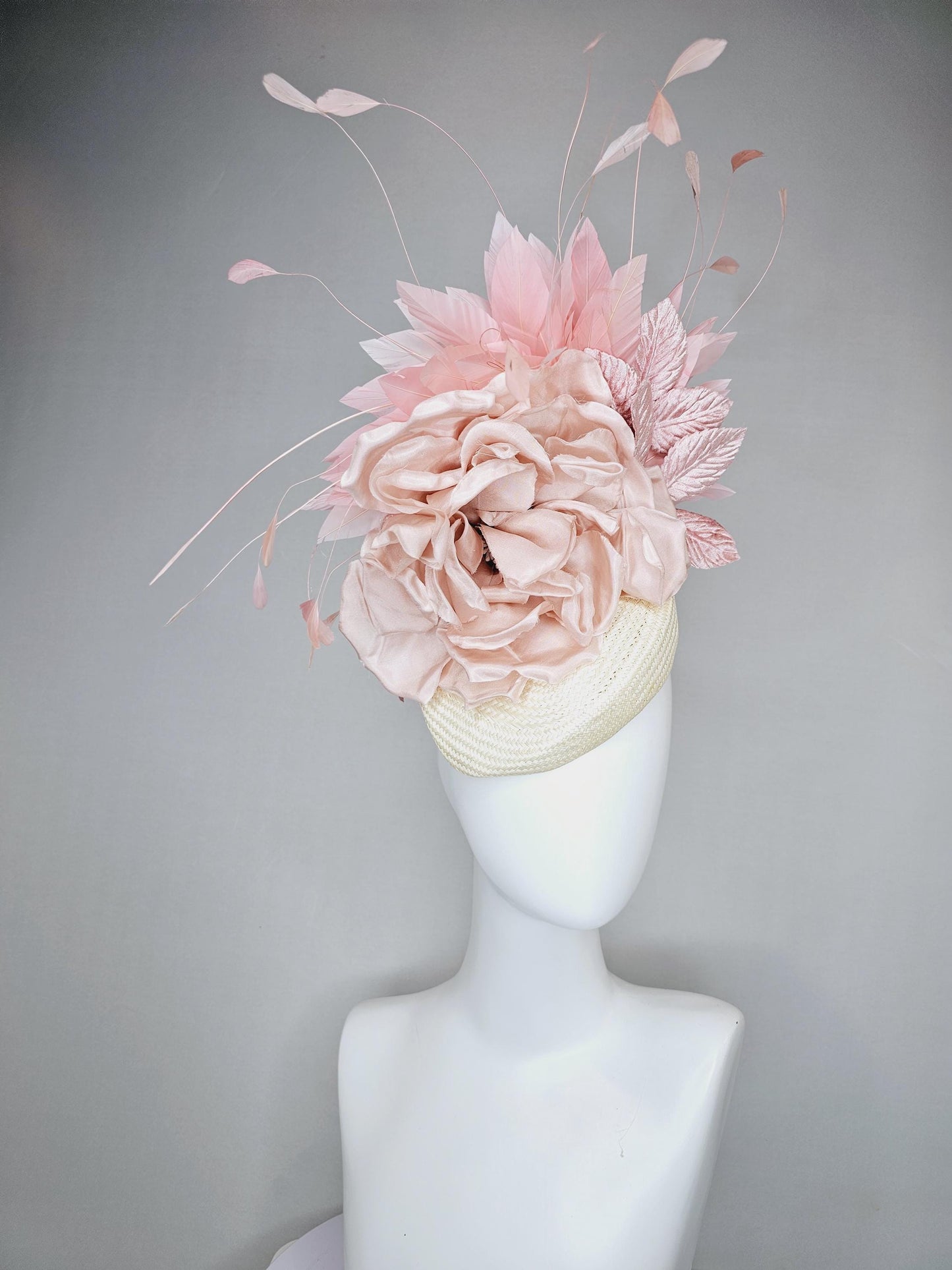 kentucky derby hat fascinator ivory white woven base,dusty pink satin silk rose flower,light pink branching feathers and light pink leaves