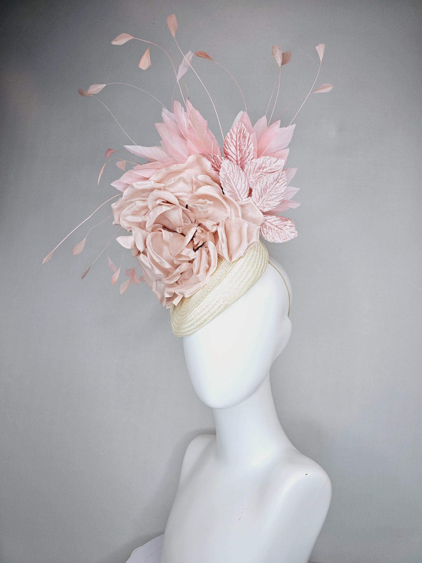 kentucky derby hat fascinator ivory white woven base,dusty pink satin silk rose flower,light pink branching feathers and light pink leaves