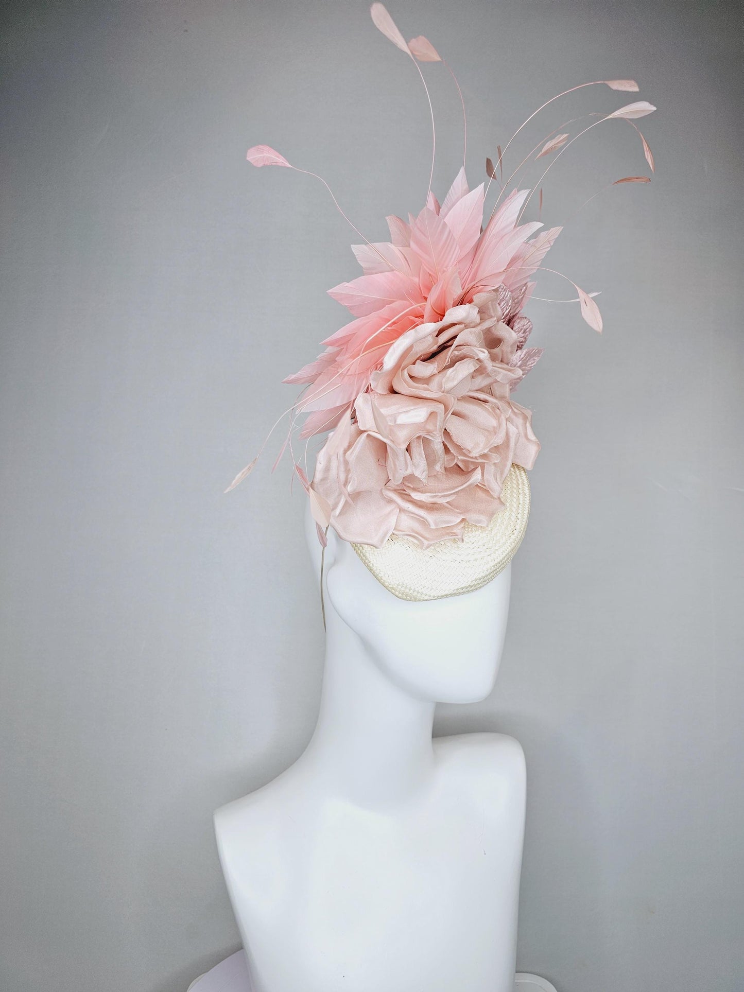 kentucky derby hat fascinator ivory white woven base,dusty pink satin silk rose flower,light pink branching feathers and light pink leaves