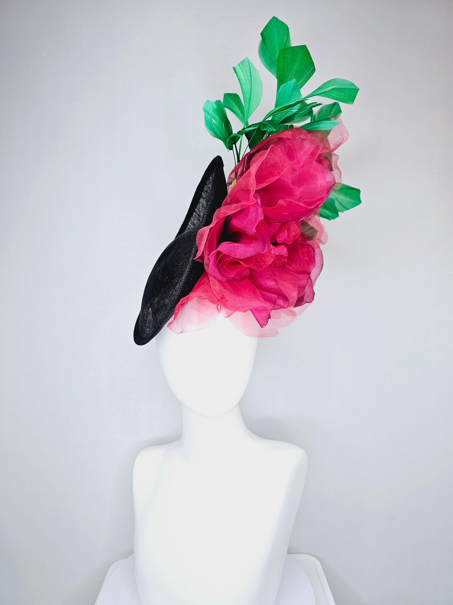 kentucky derby hat fascinator black sinamay saucer with large raspberry pink red organza satin rose and emerald green branching feathers