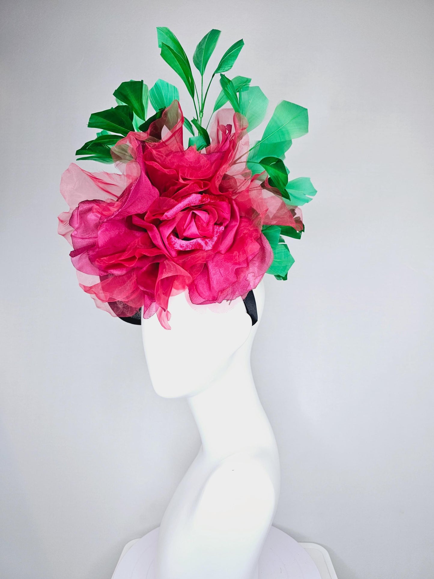 kentucky derby hat fascinator black sinamay saucer with large raspberry pink red organza satin rose and emerald green branching feathers