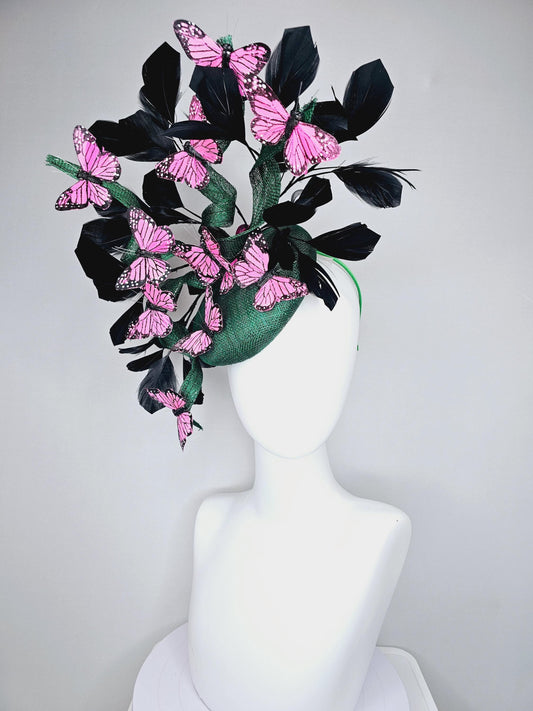 kentucky derby hat fascinator dark green sinamay with sinamay curls and black branching feathers with pink and black butterflies