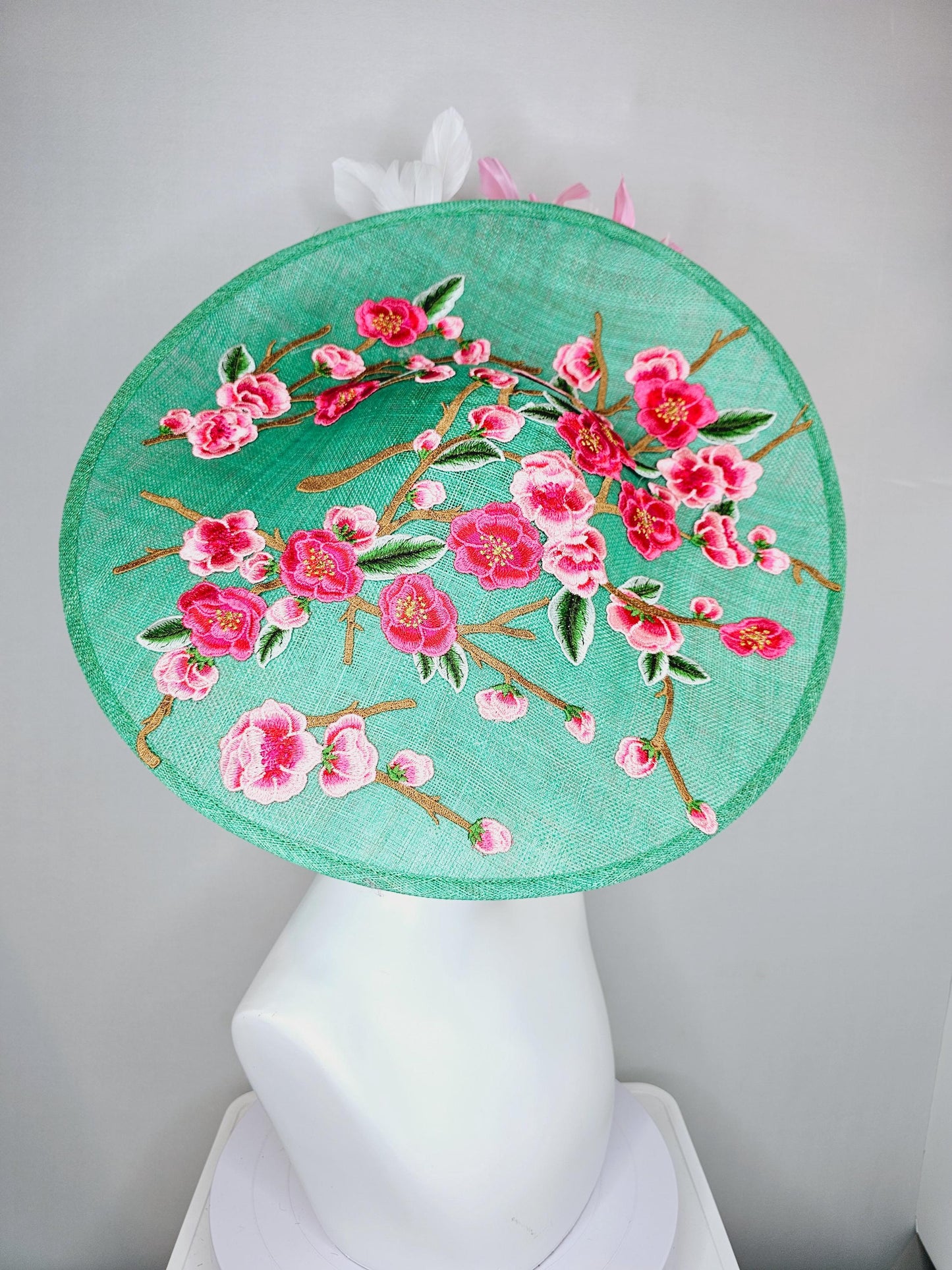 kentucky derby hat fascinator large mint green sinamay saucer with pink red green brown embroidered flowers, blush pink and white feathers